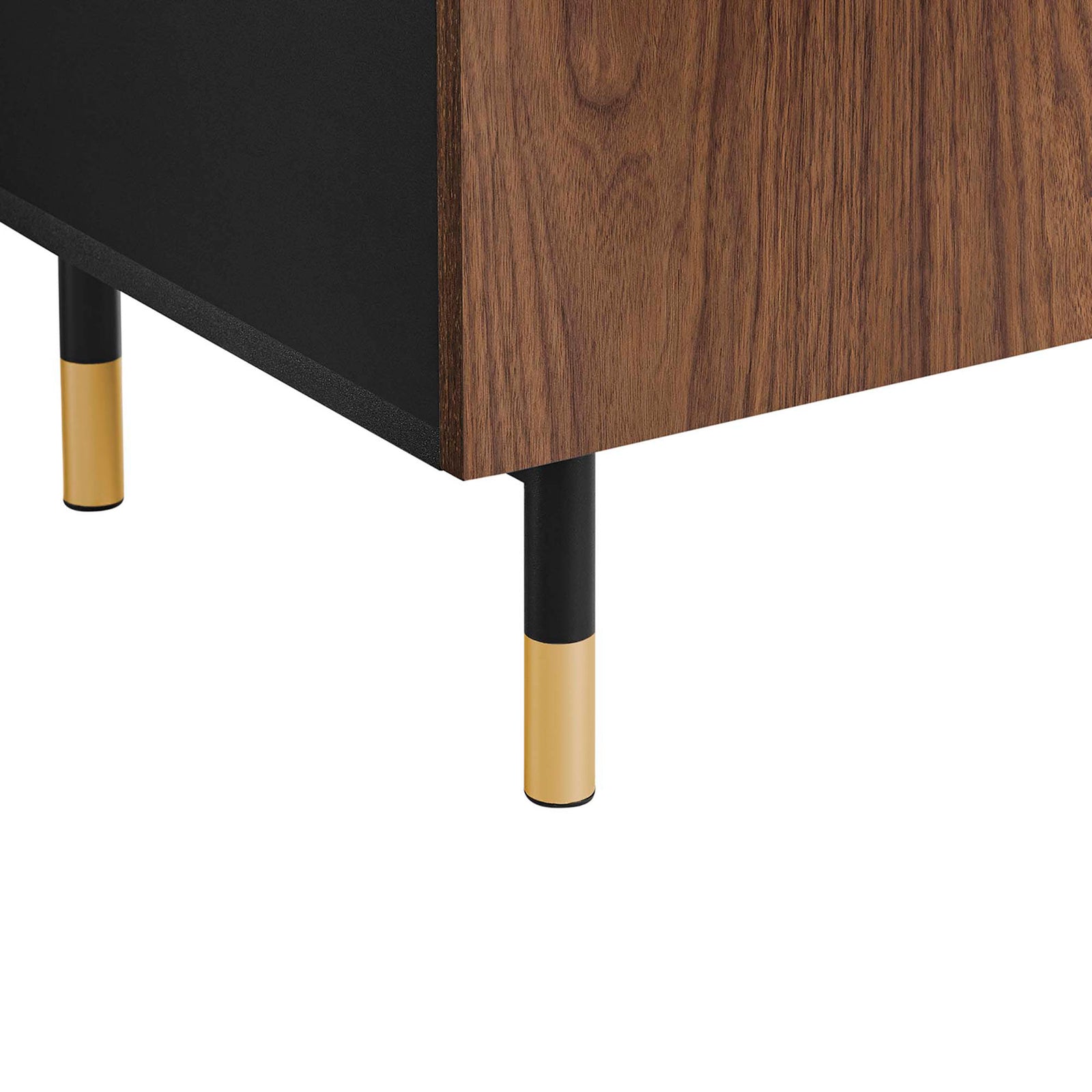 Close up of slim black metal leg with gold cap on the Nexus TV stand || EEI-6282-BLK-WAL || leg_studio