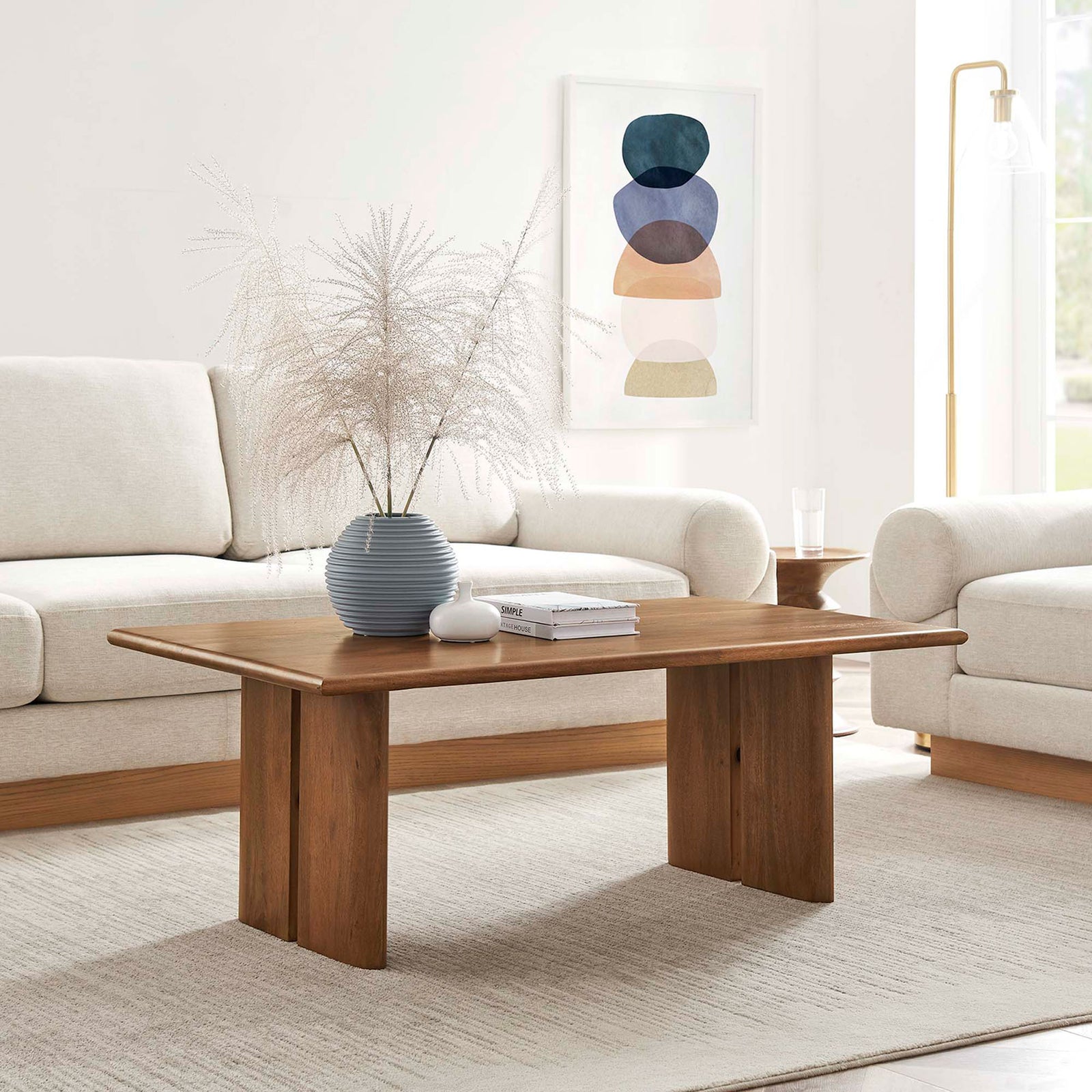 Warm walnut coffee table anchors the living room with clean lines and a spacious surface || EEI-6341-WAL || front_angle_room
