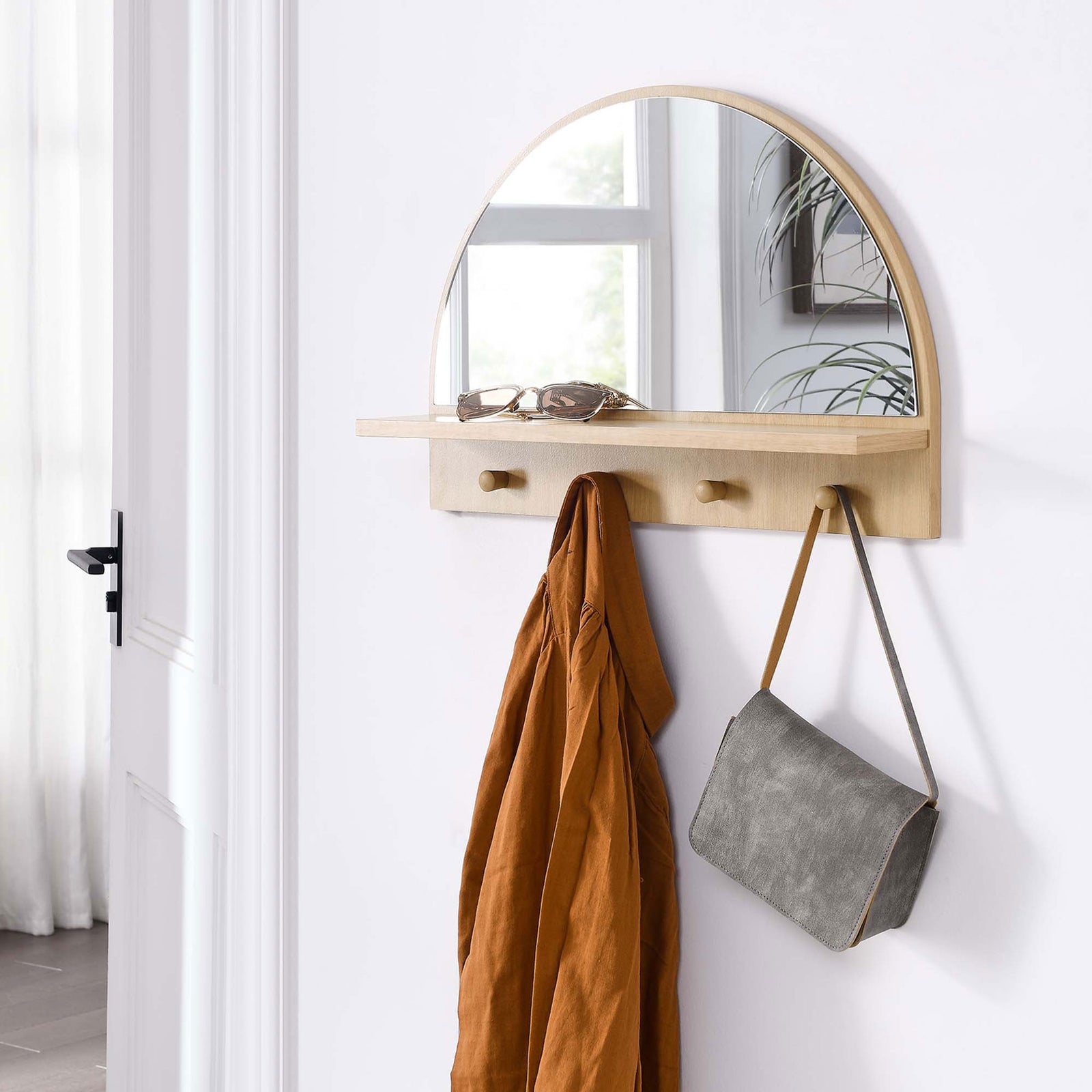 Wall-mounted Moonbeam oak arched mirror creates a tidy landing zone for everyday essentials || EEI-6350-OAK || front_angle_room