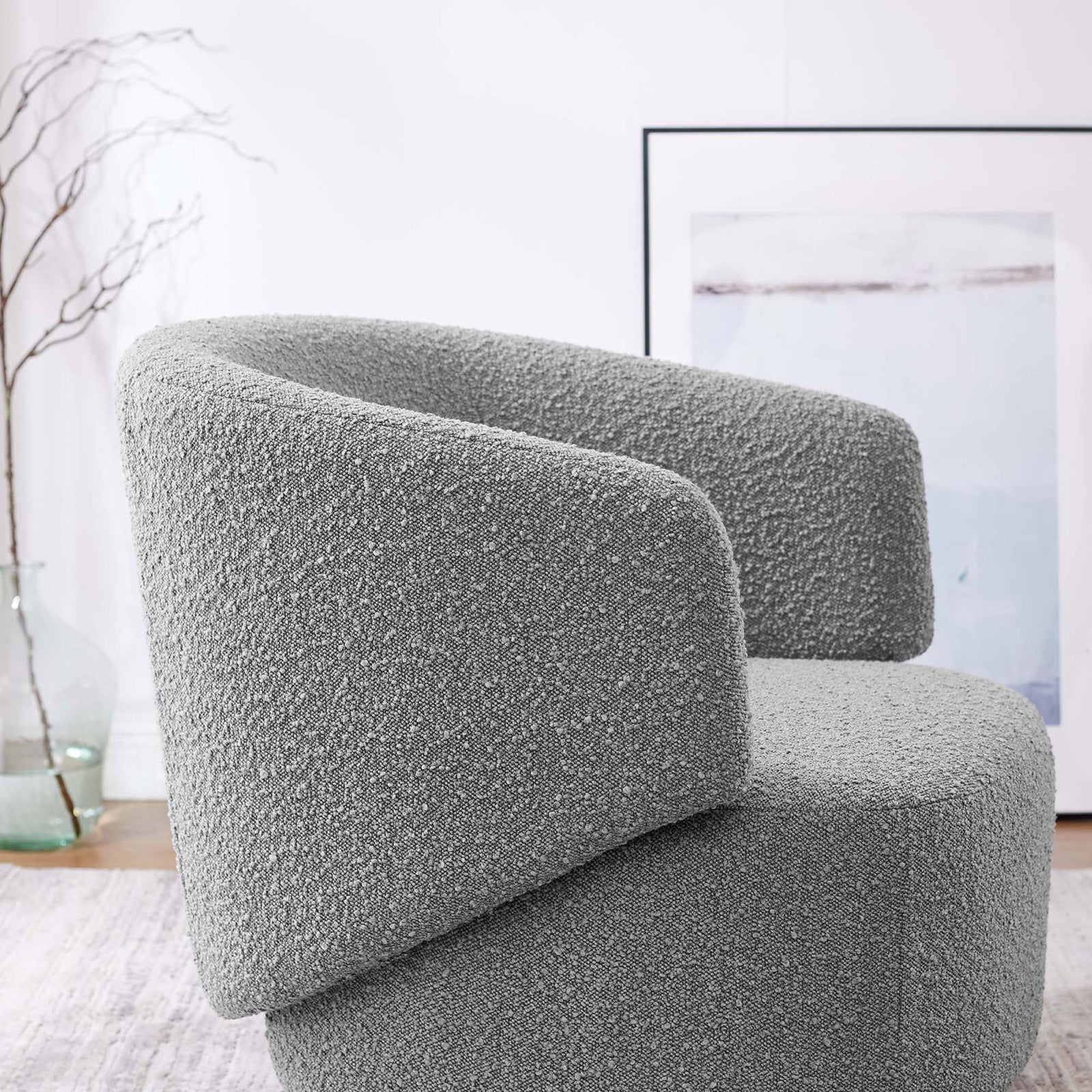 Nubby boucle texture and sculpted arm detail add dimension to this modern swivel chair || EEI-6357-LGR || detail_room