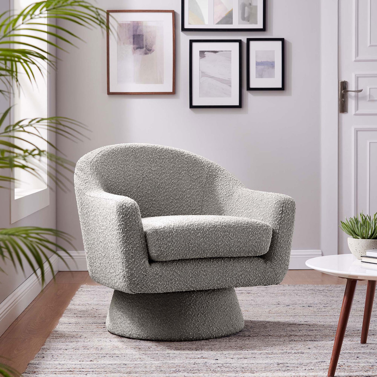 Modern taupe boucle swivel chair elevates the living room with soft curves and comfort. || EEI-6359-TAU || front_angle_room