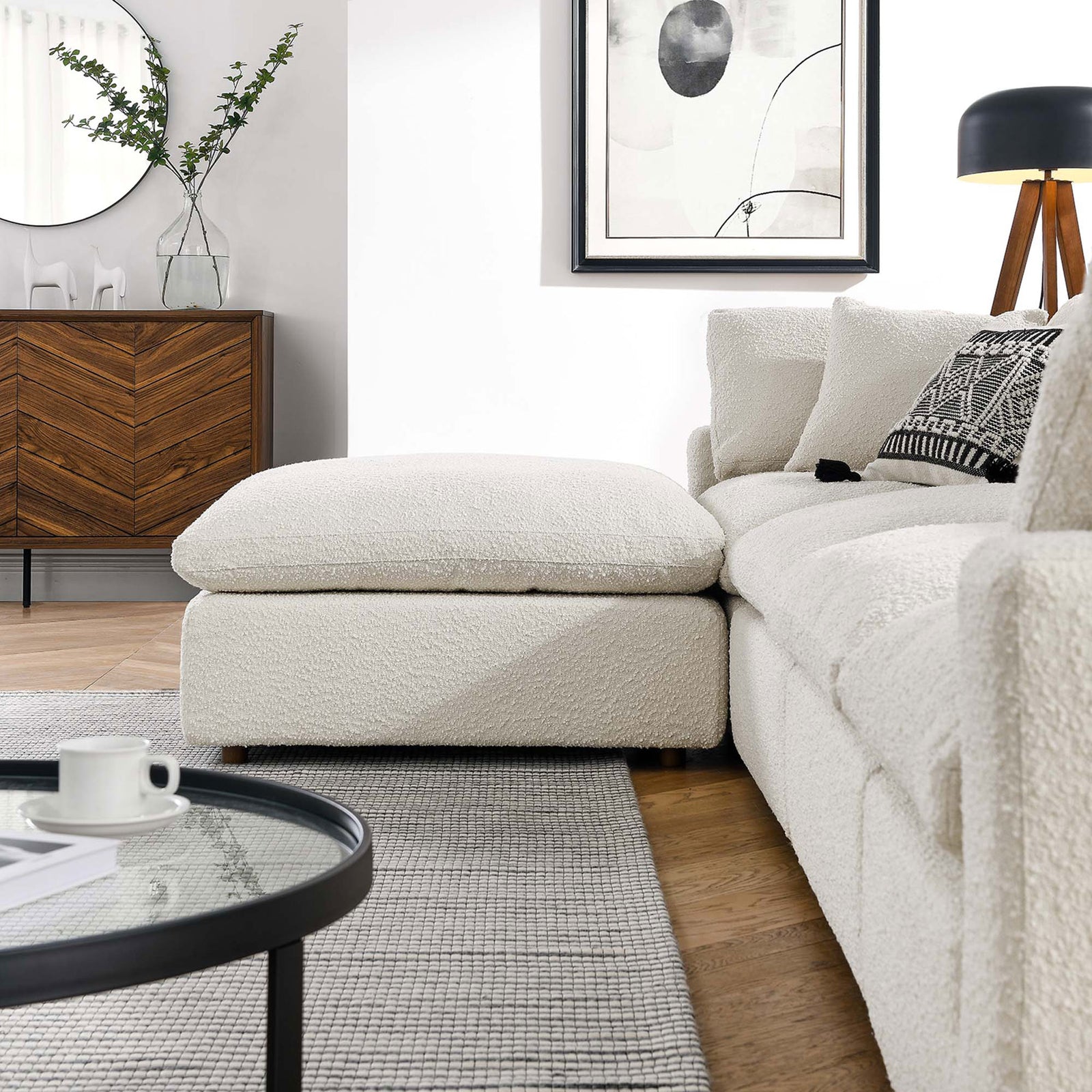 Ivory boucle chaise sectional styled in a modern living room with warm wood accents || EEI-6365-IVO || detail_room