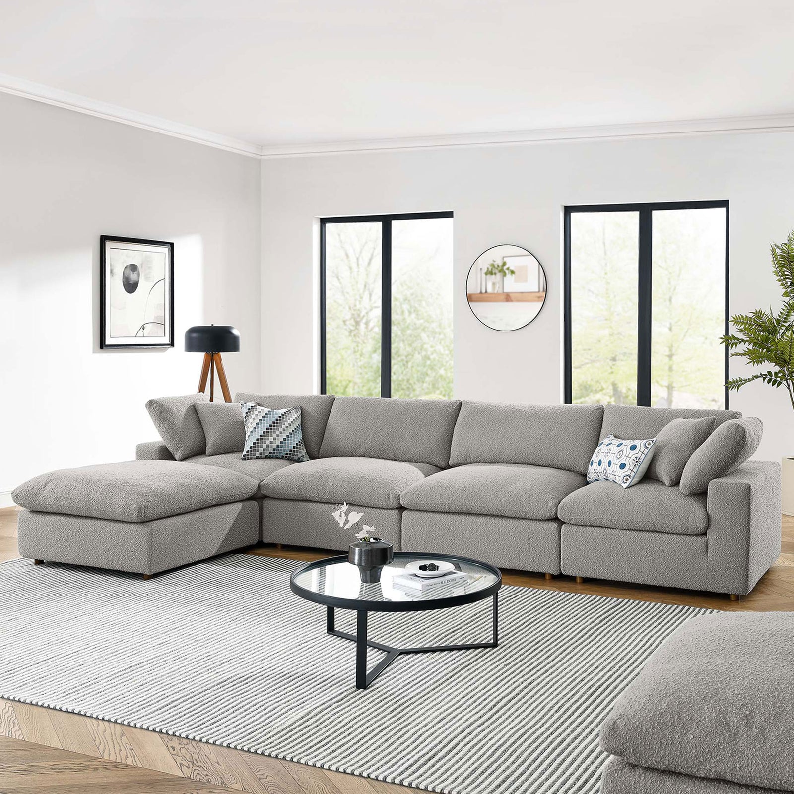 Light gray boucle sectional with chaise in a bright living room with rug, round coffee table, and lamp. || EEI-6365-LGR || front_room