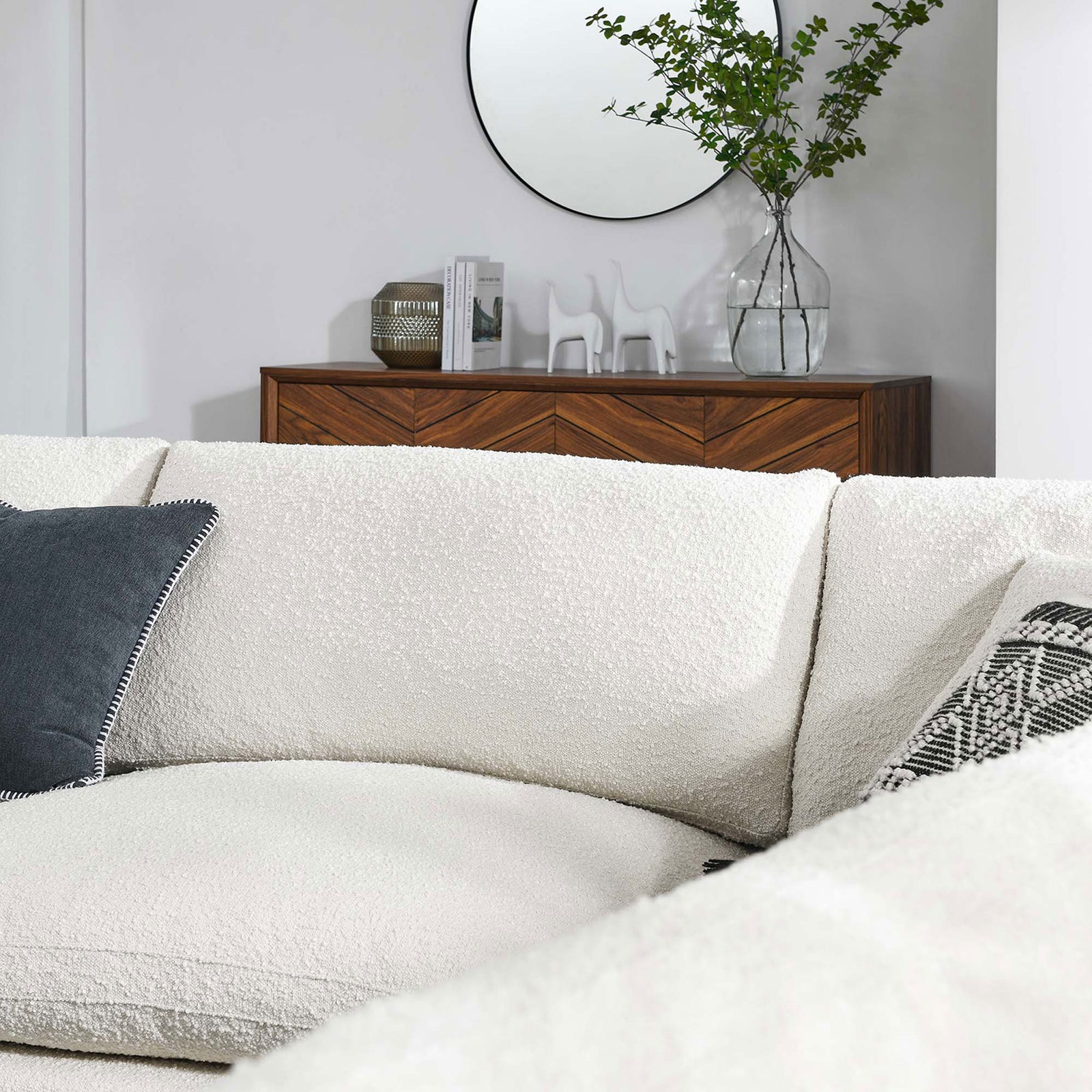 Detail of the ivory boucle sectional showing the cozy corner and inviting seat depth || EEI-6367-IVO || detail_room