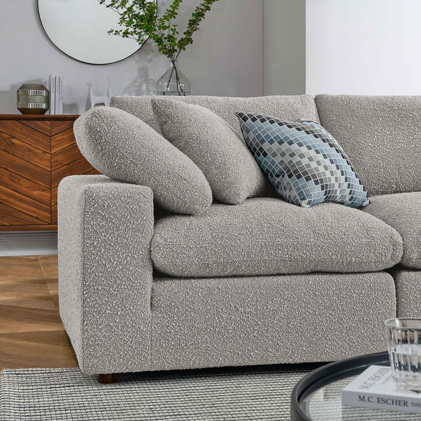Cozy corner of the light gray boucle sectional styled with accent pillows in a modern living room || EEI-6368-LGR || detail_room