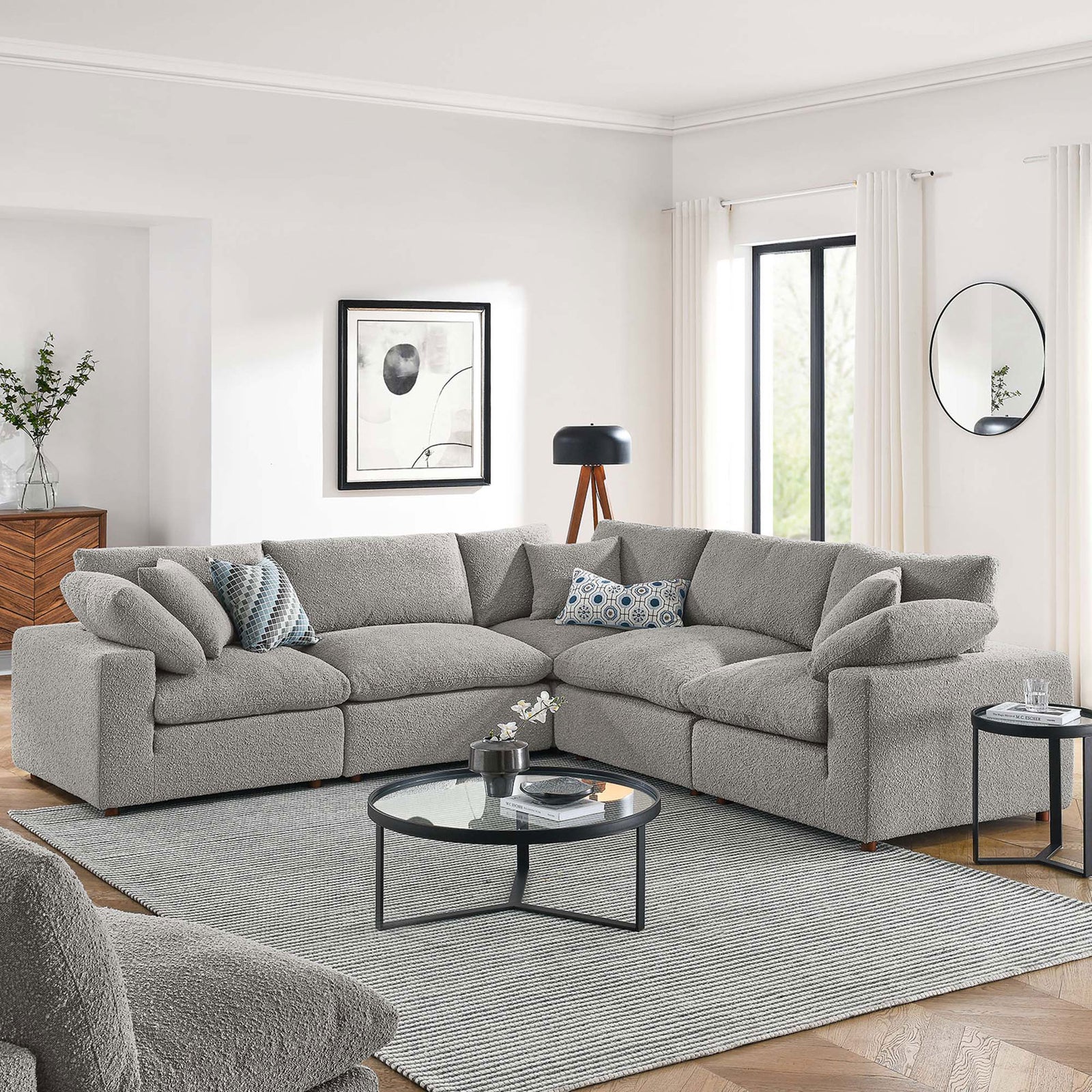 Spacious light gray boucle sectional anchored in a bright living room with modern tables and decor || EEI-6368-LGR || front_angle_room