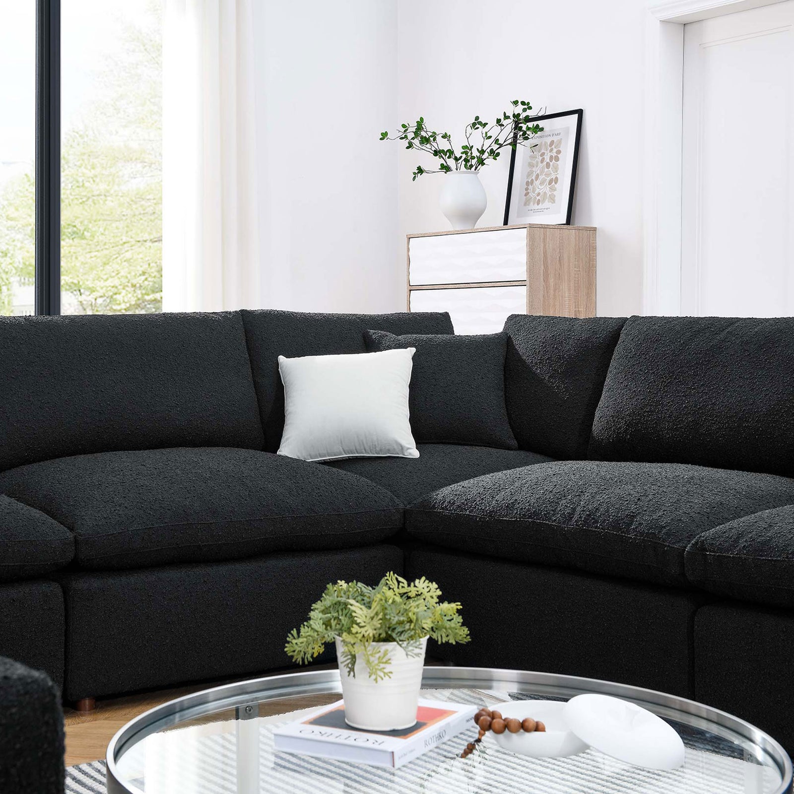 Cozy black boucle sectional corner styled with a light accent pillow in a bright modern living room || EEI-6371-BLK || detail_room