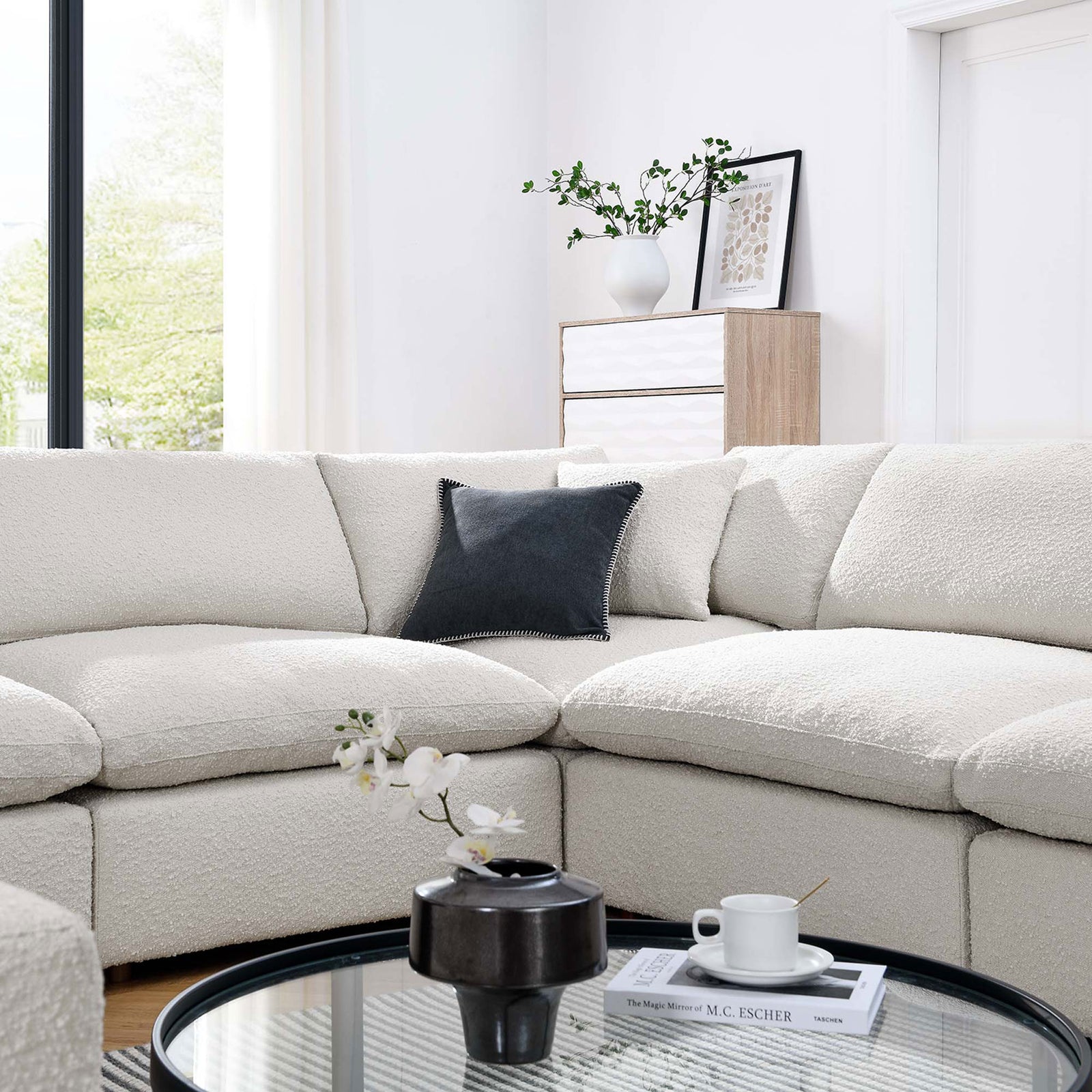Cozy ivory boucle sectional corner styled with modern decor for an inviting, light-filled living room || EEI-6371-IVO || detail_room