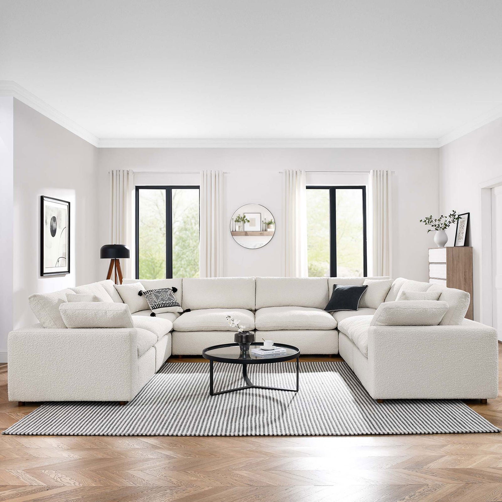 Expansive ivory boucle sectional anchors a bright contemporary living room with layered neutrals and soft textures || EEI-6371-IVO || front_angle_room