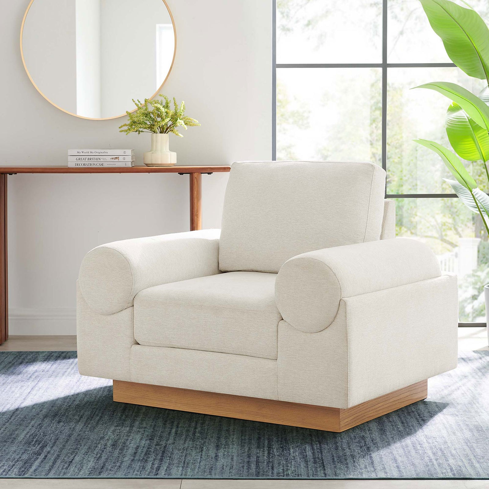 Modern ivory armchair on a wood plinth base brings plush comfort to any living space || EEI-6402-IVO || front_angle_room