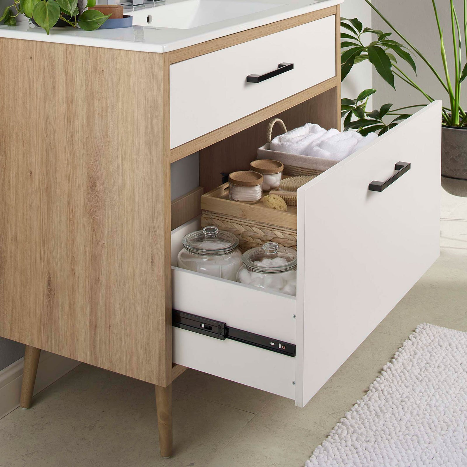 Extra-wide drawer keeps bath items organized and within easy reach || EEI-6500-WHI-OAK || storage_open_room