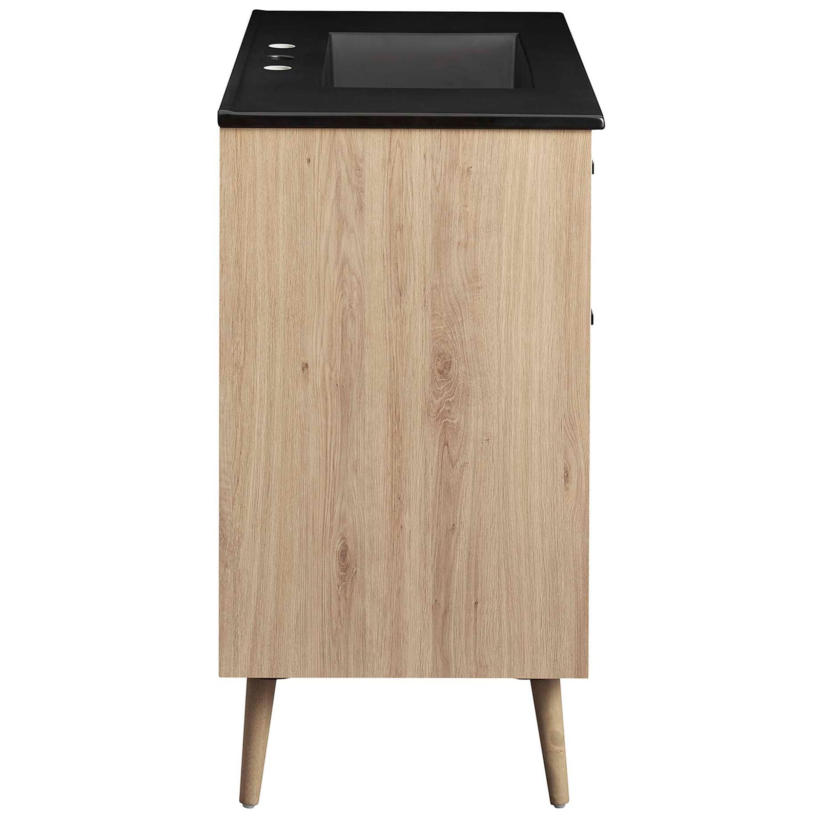 Streamlined vanity profile in warm oak with integrated black countertop and tapered legs || EEI-6501-BLK-OAK || side_studio