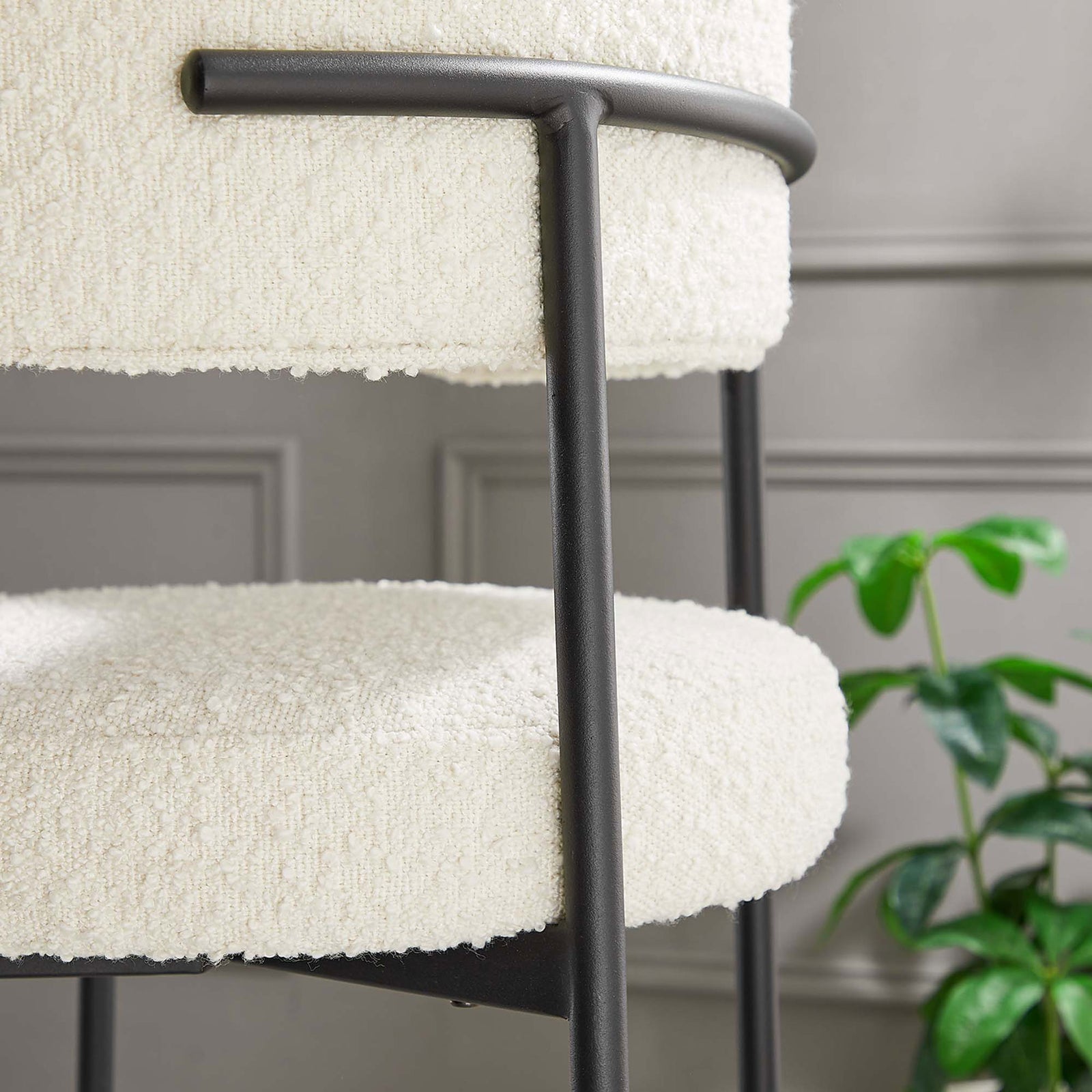 Boucle texture and matte frame complement refined dining decor. || EEI-6520-IVO-BLK || detail_room