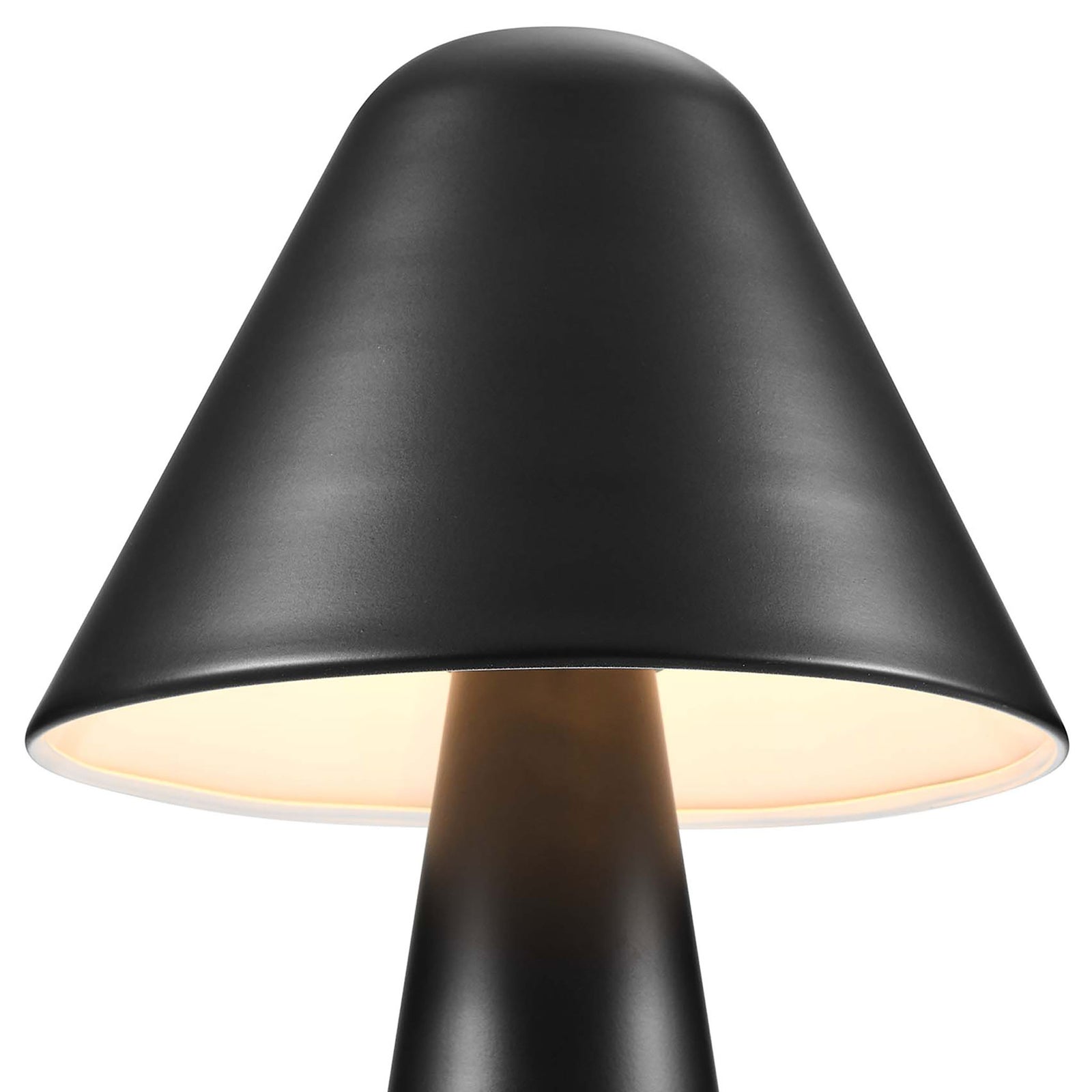Warm light glows under the black mushroom shade for focused yet gentle illumination. || EEI-6529-BLK || shade_on_studio