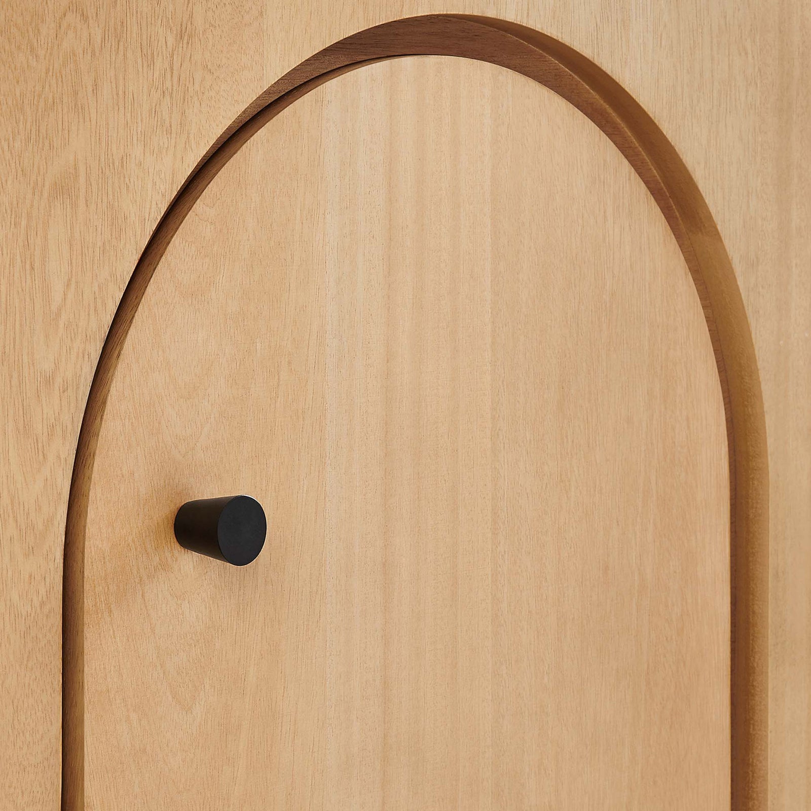 Oak veneer arch detail with matte black knob adding modern contrast against the warm wood grain || EEI-6538-OAK || handle_studio