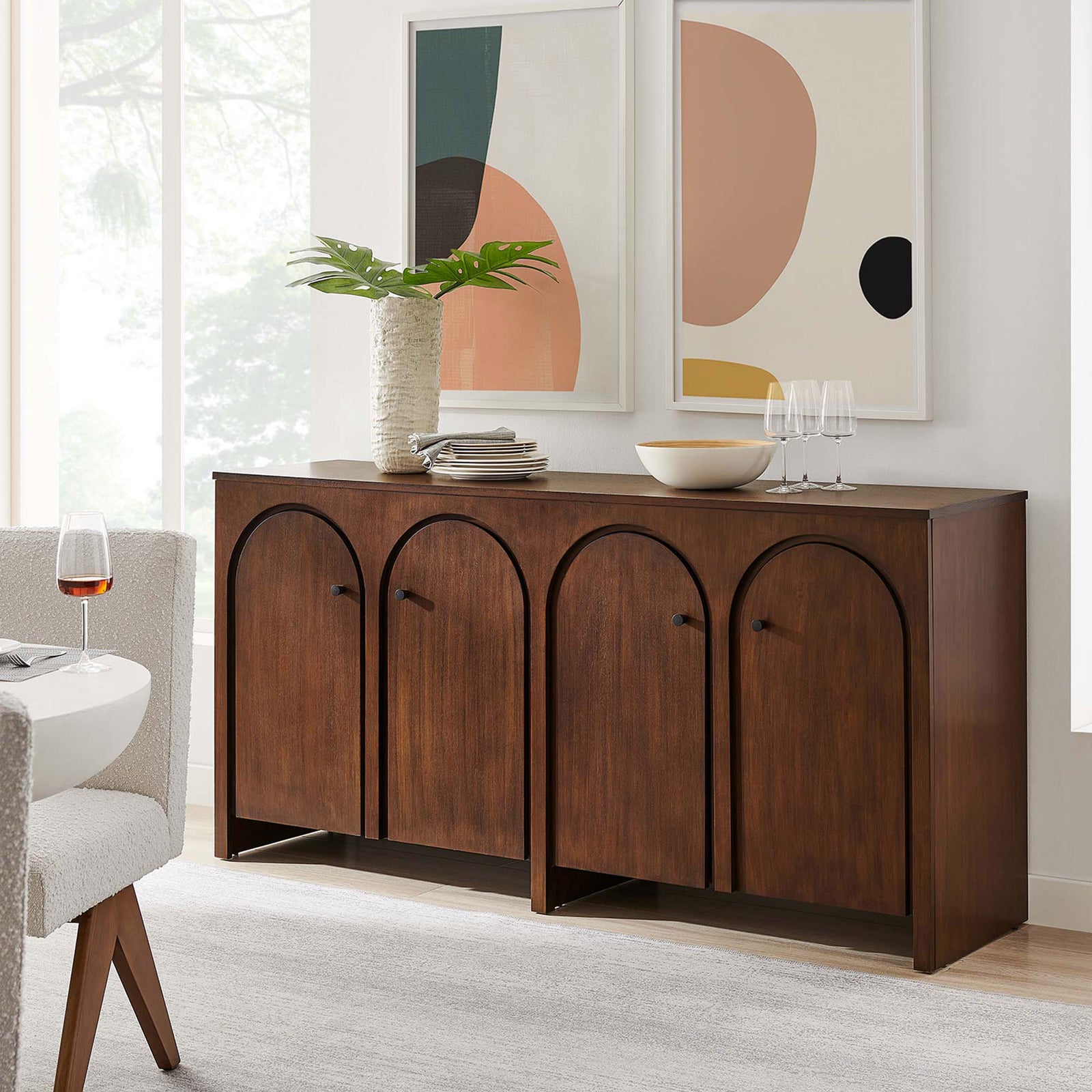 Walnut Appia sideboard styled in a modern dining room with art, greenery, and serveware || EEI-6538-WAL || front_angle_room