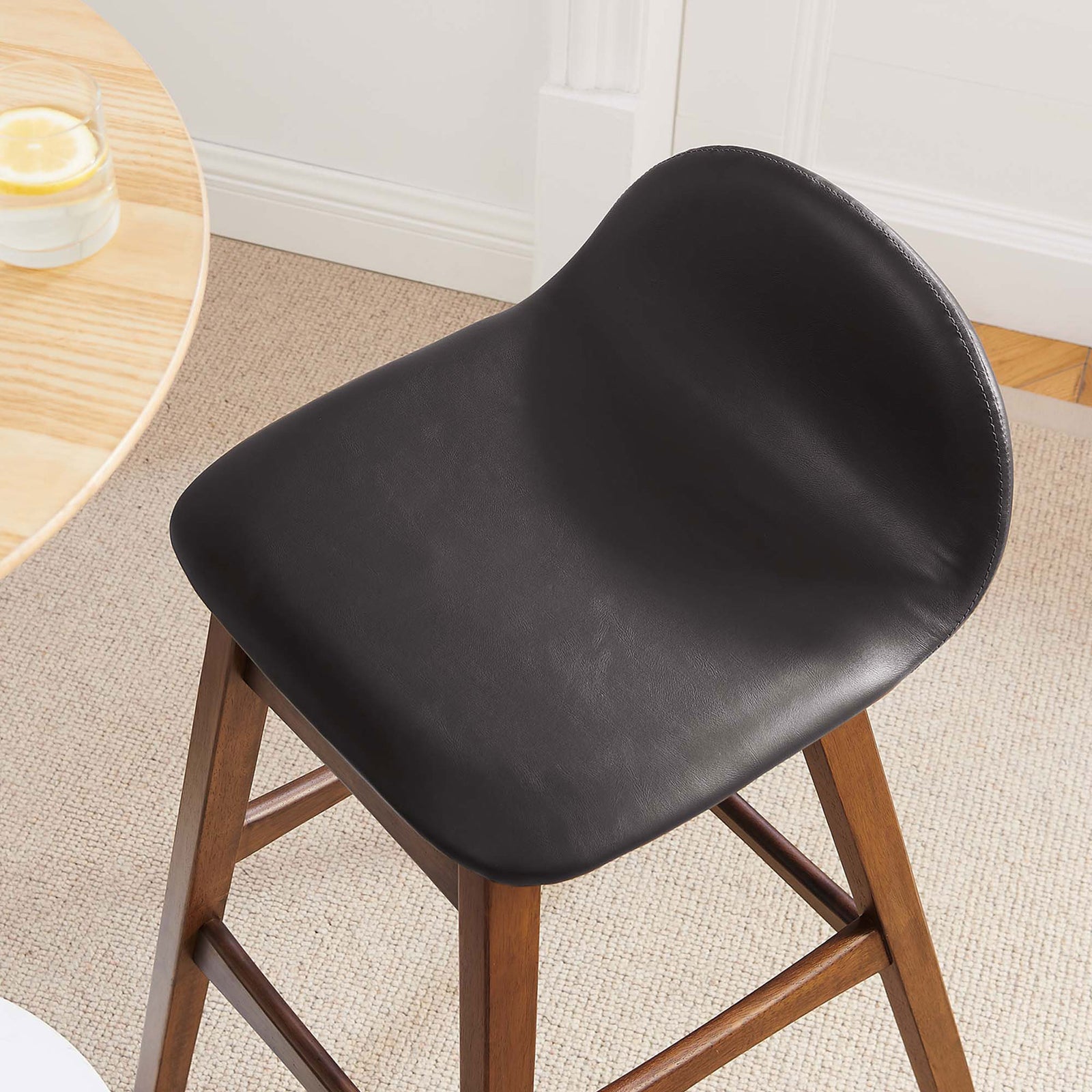 Refined vegan leather seat and curved low back lend modern polish to your bar area || EEI-6554-BRN || detail_room