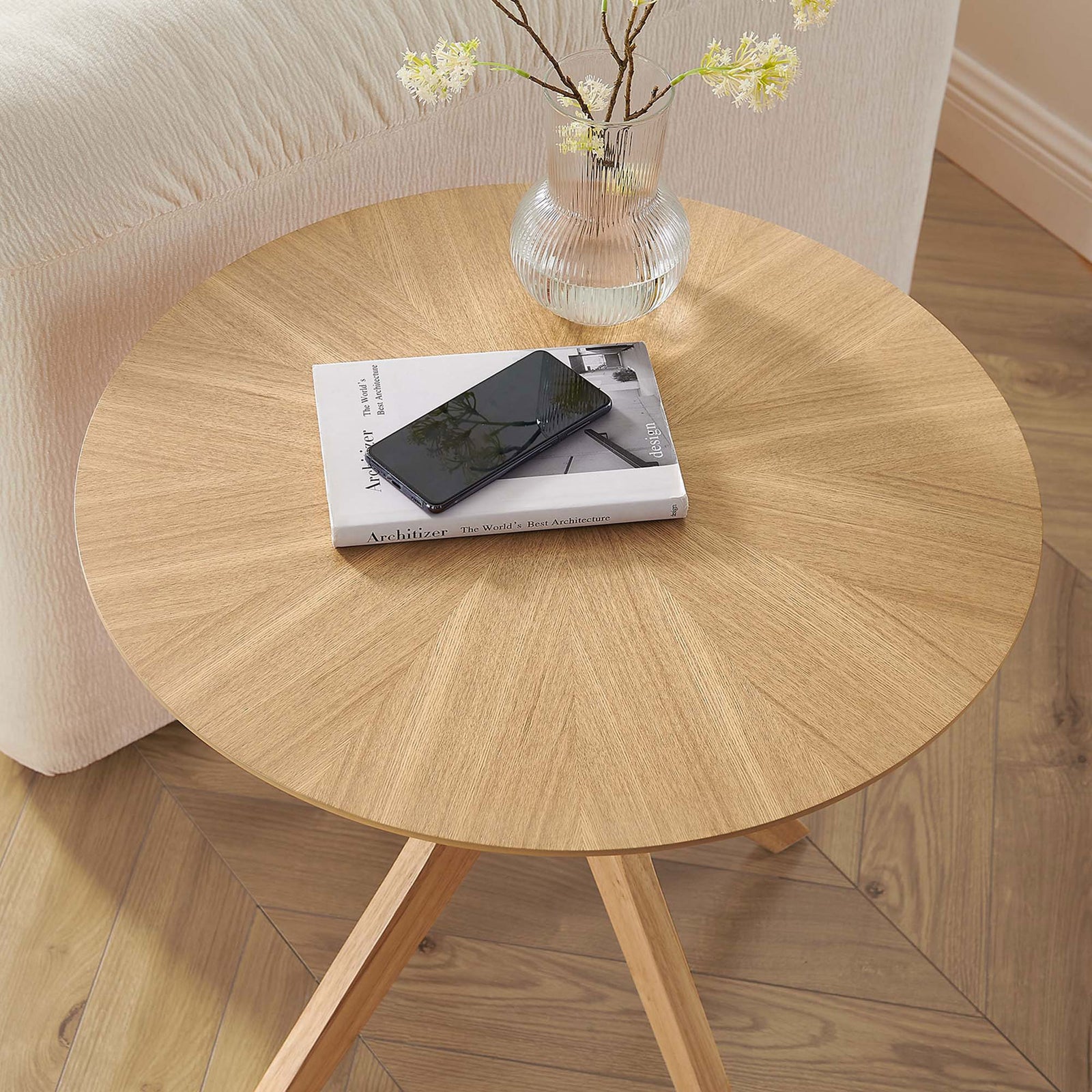 Oak side table styled with decor, offering a handy surface for books, vase, and phone in a cozy living room. || EEI-6558-OAK || detail_room