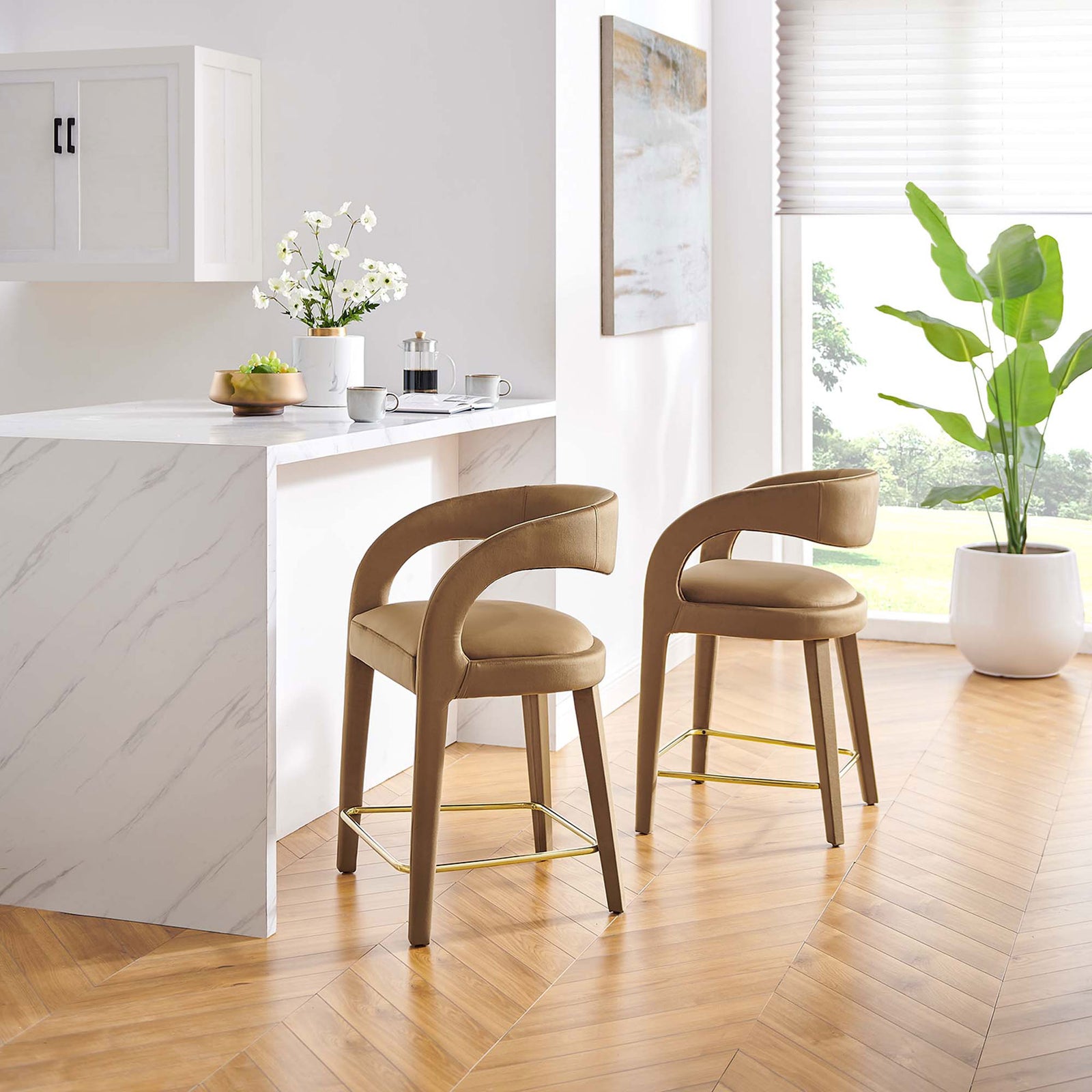 Pair of counter stools bring modern curves and plush velvet to the kitchen, finished with a gold footrest || EEI-6566-BRN-GLD || front_angle_multi_room