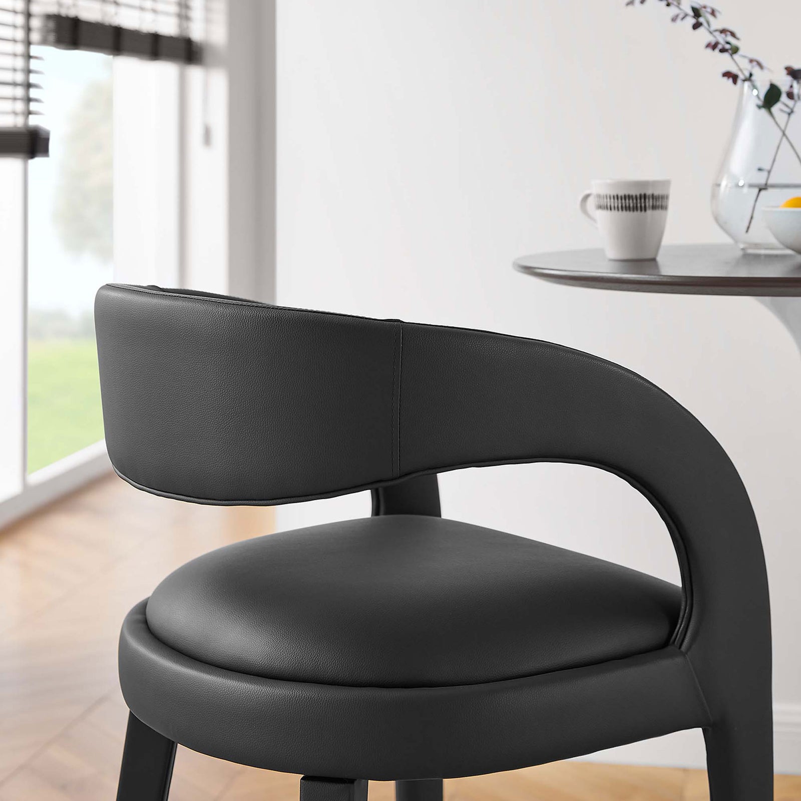 Vegan leather seat and wraparound back provide cushioned support at the bar || EEI-6567-BLK-BLK || detail_room