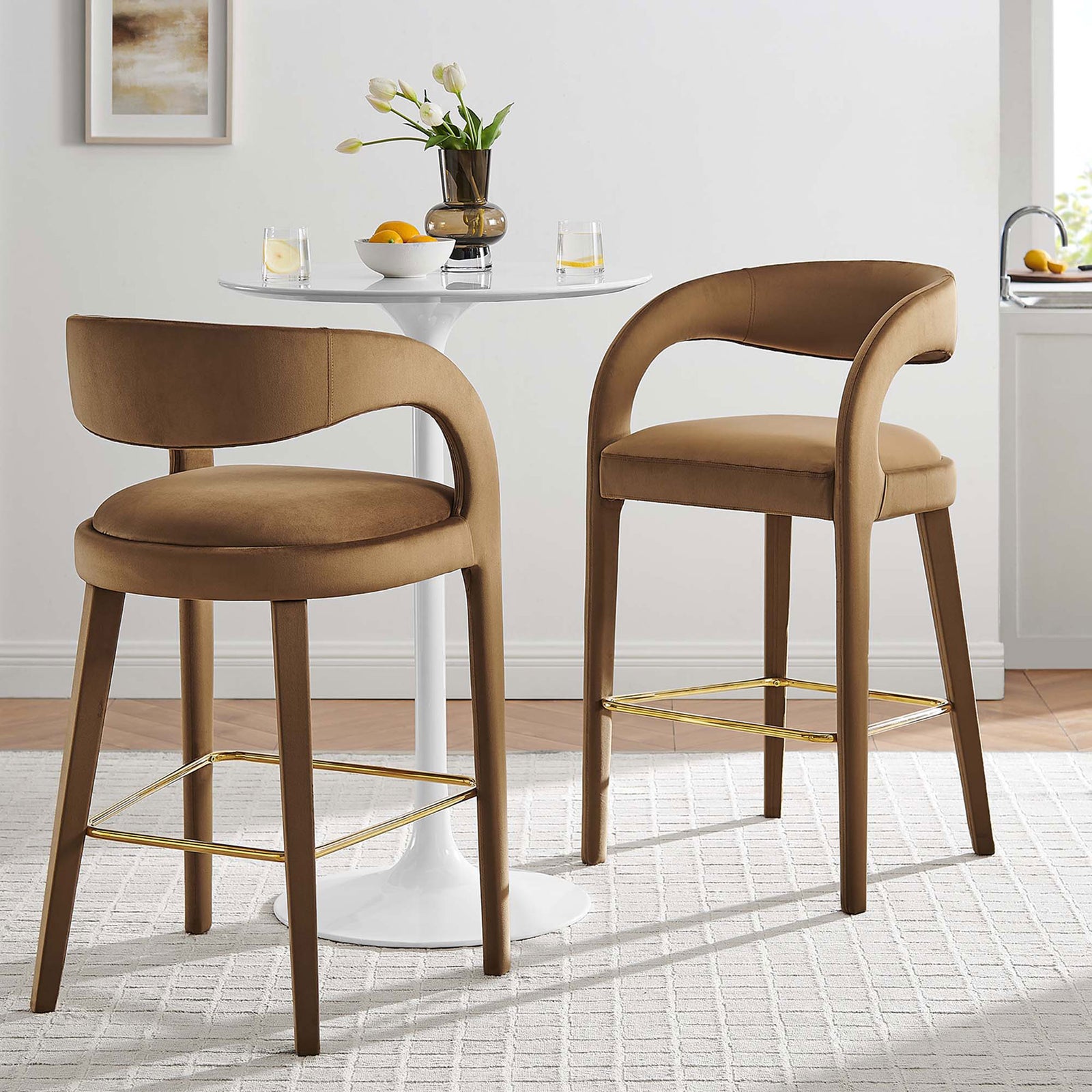 Pair of bar stools add modern curves and plush comfort around the table with a gold footrest || EEI-6569-BRN-GLD || front_angle_multi_room