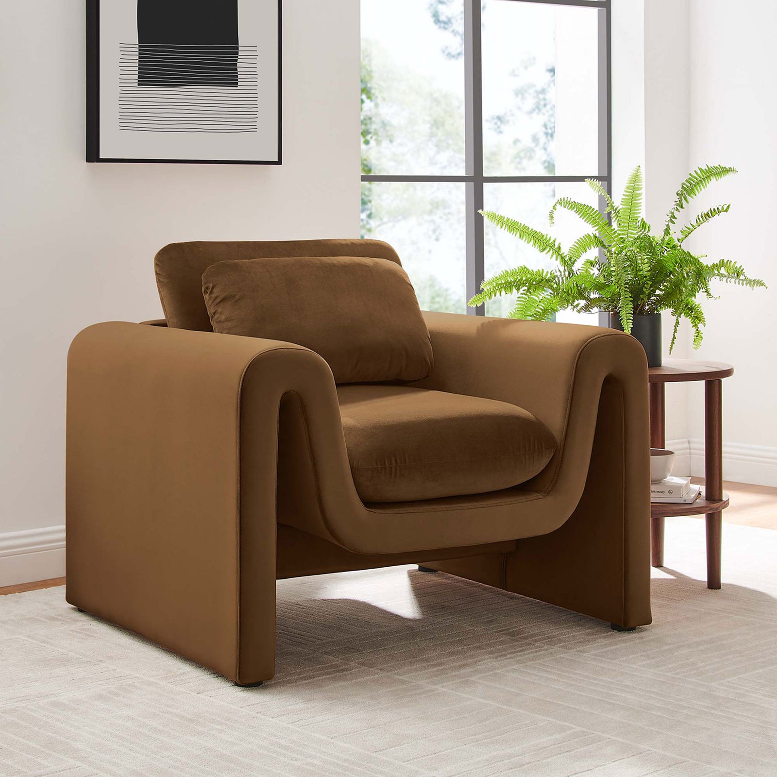 Modern brown velvet armchair brings sculptural curves to a bright, inviting living space || EEI-6576-BRN || front_angle_room