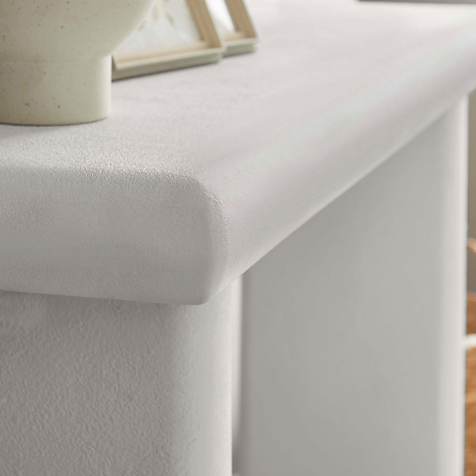 Textured white finish and rounded edge lend soft sophistication to curated decor || EEI-6577-WHI || detail_room