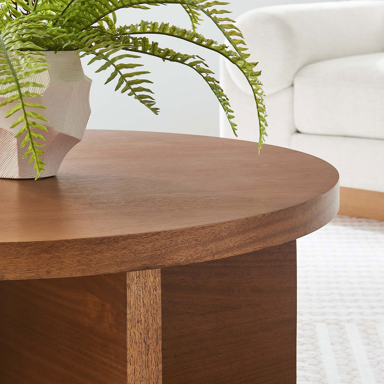 Rich walnut finish and natural grain bring warmth to modern living spaces || EEI-6580-WAL || detail_room