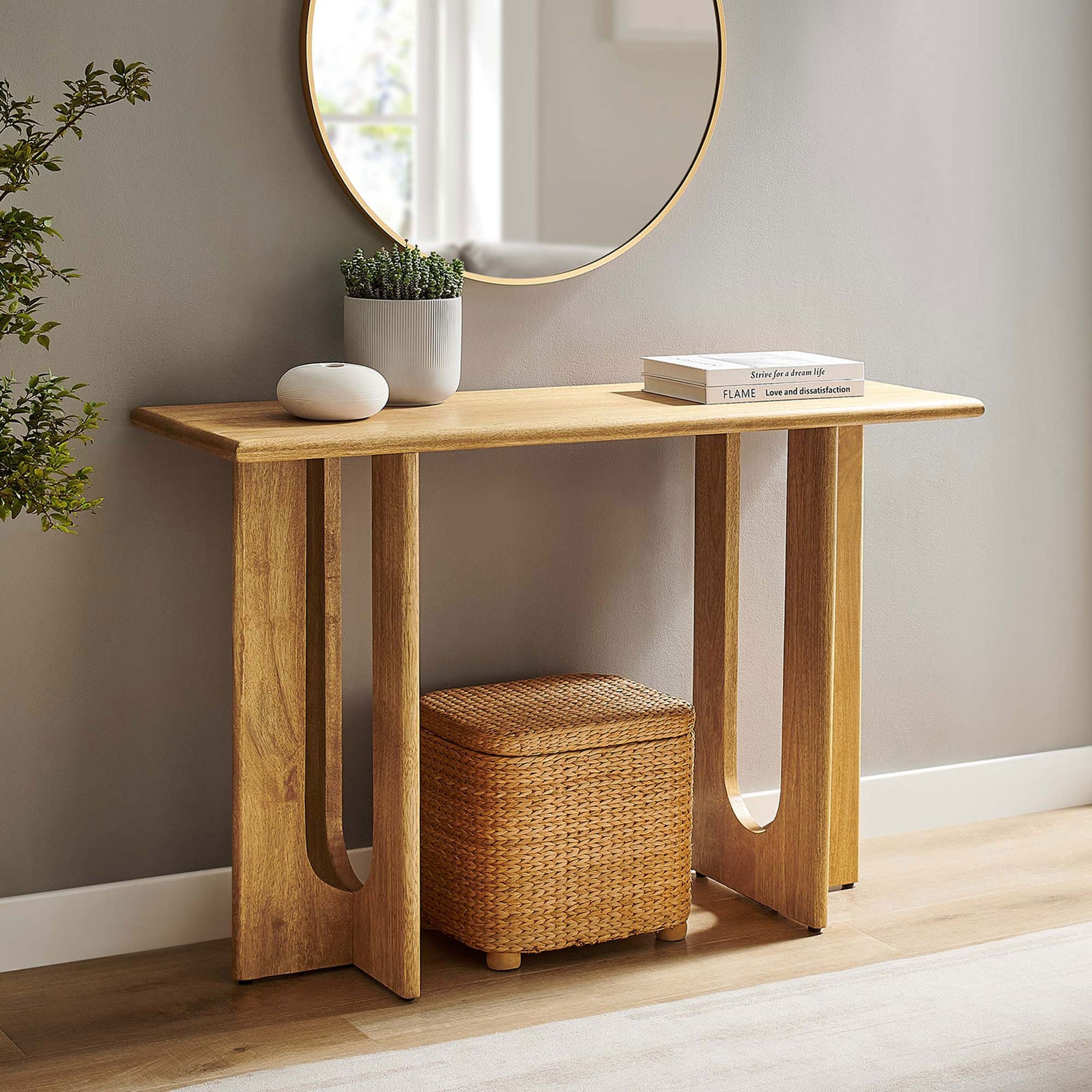 Statement console elevates any room with its sculptural base and natural wood warmth || EEI-6596-OAK || front_angle_room