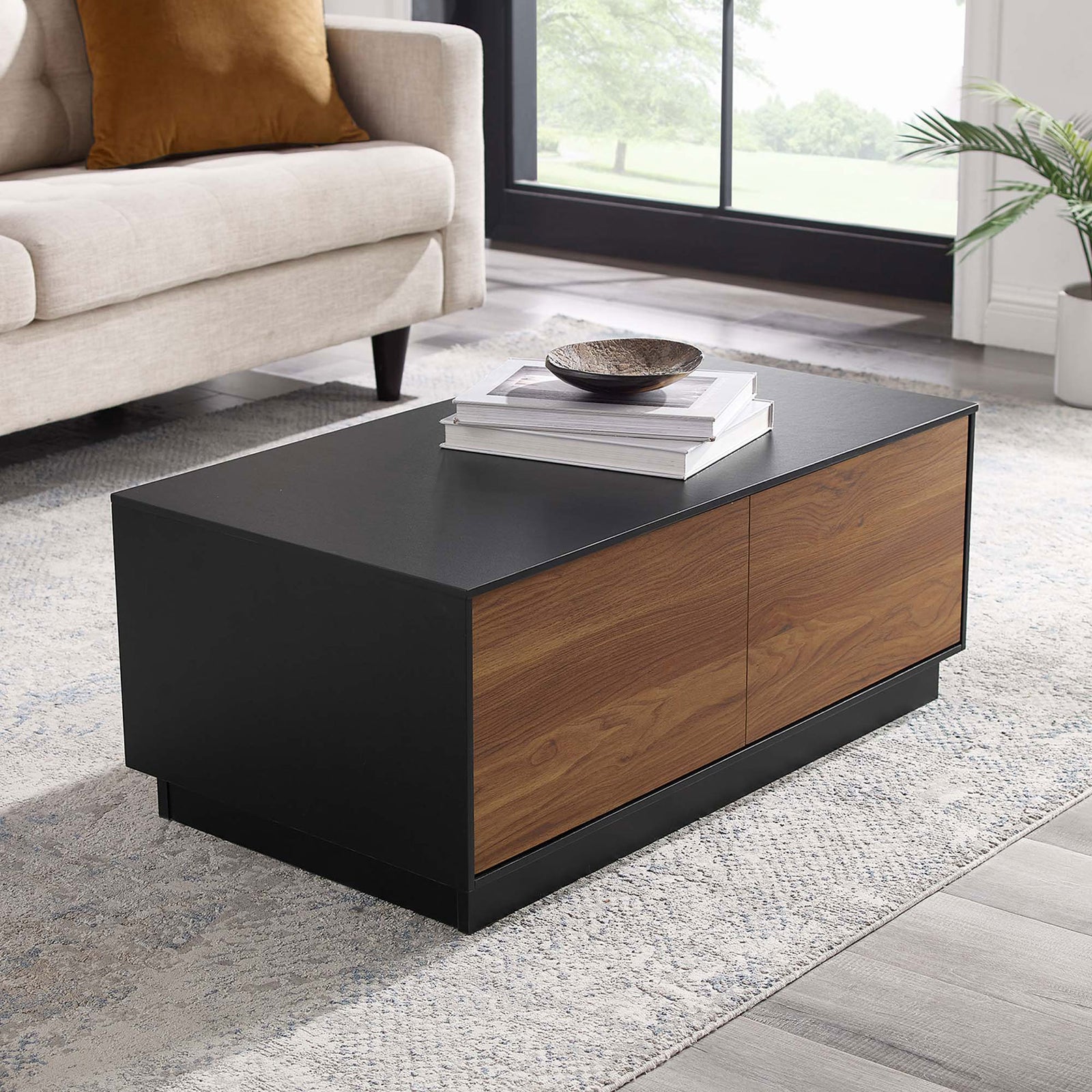 Modern coffee table anchors the living room with a black top and walnut drawer fronts || EEI-6599-BLK-WAL || front_angle_room