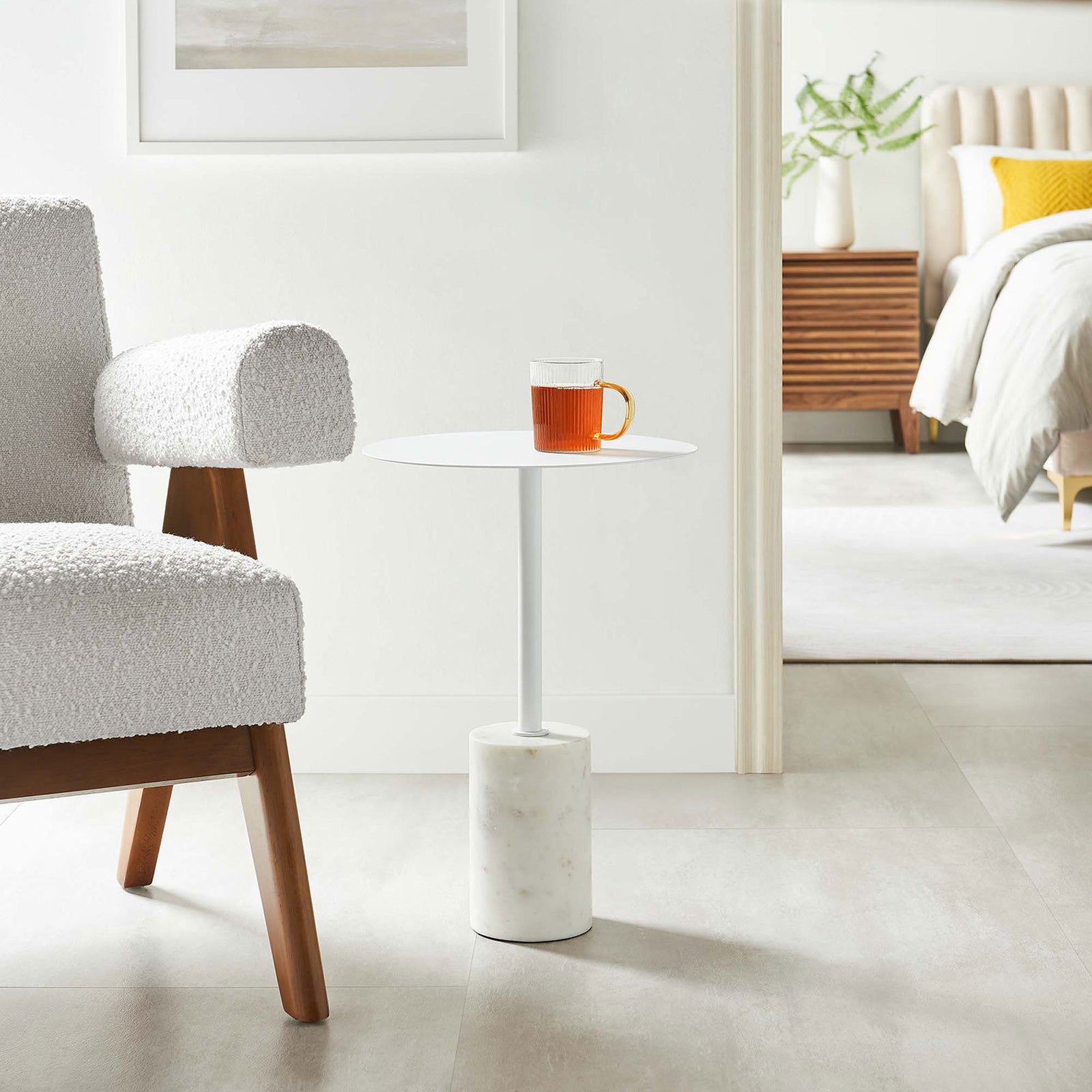 Sleek Lyric side table with marble base complements contemporary living and bedroom spaces with minimalist charm. || EEI-6605-WHI-WHI || front_angle_room