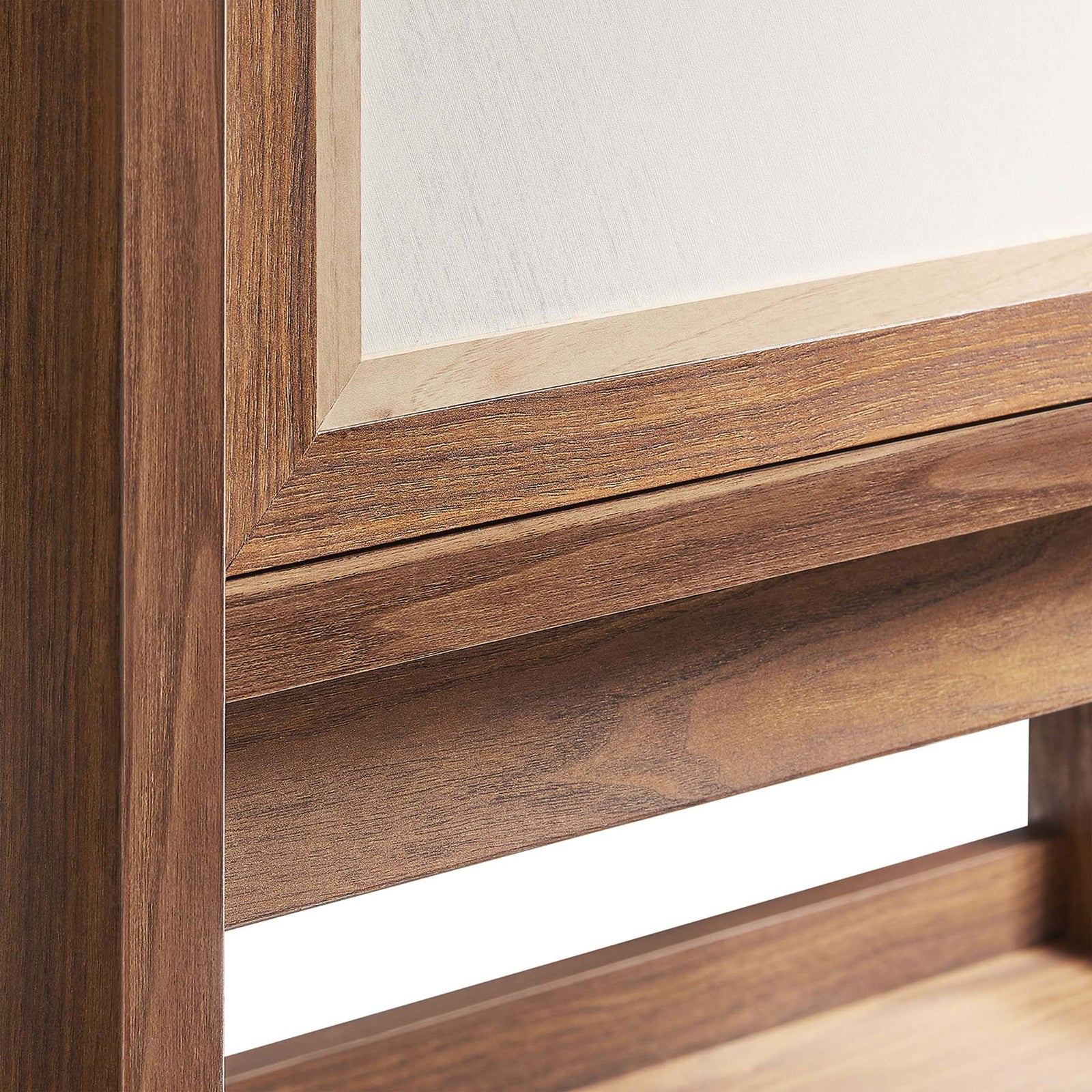 Close-up of walnut frame and linen-textured door panel showing rich grain and refined trim || EEI-6620-WAL || detail_studio