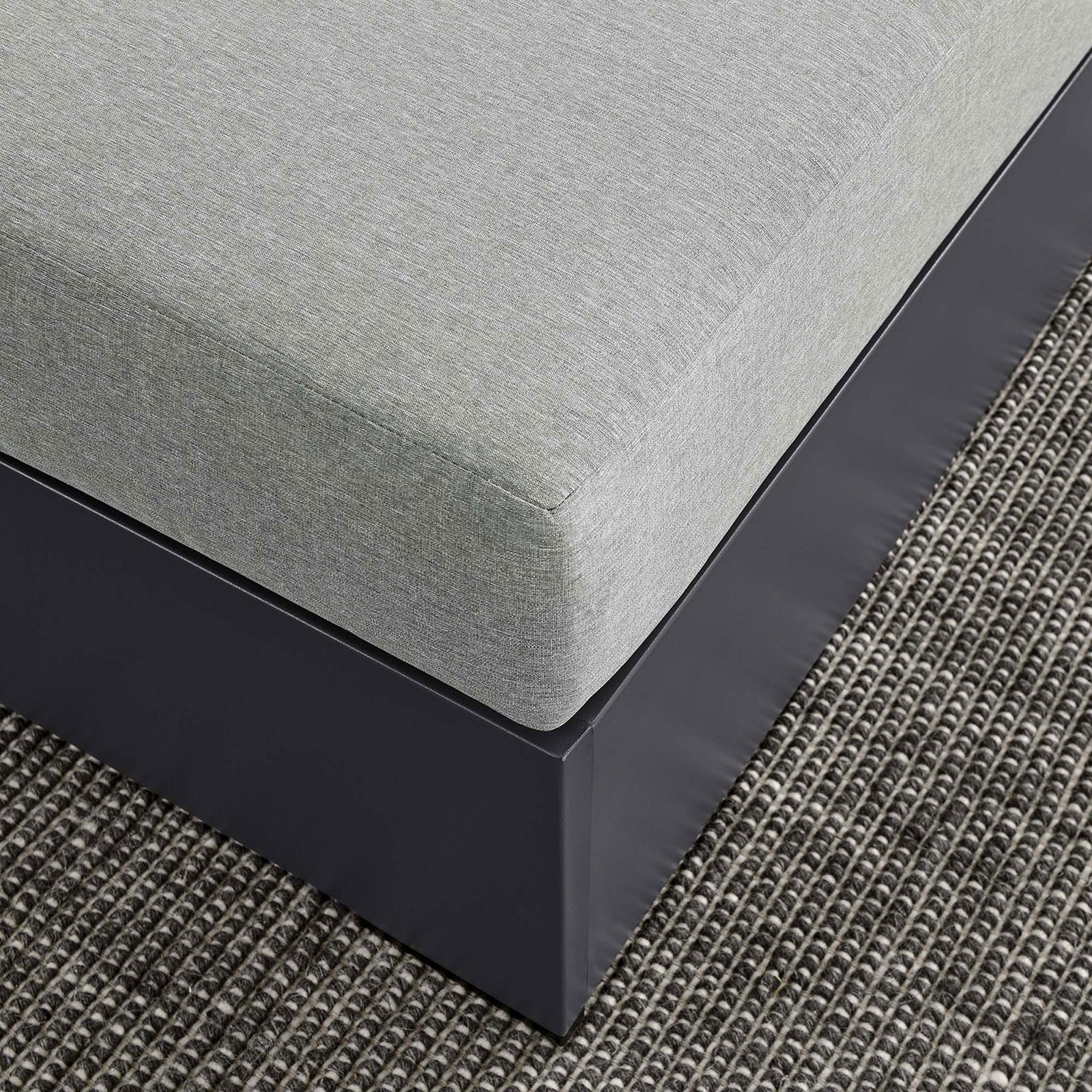 Gray cushion and woven outdoor rug together highlight the layered textures of the patio setting || EEI-6627-GRY-GRY || detail_room