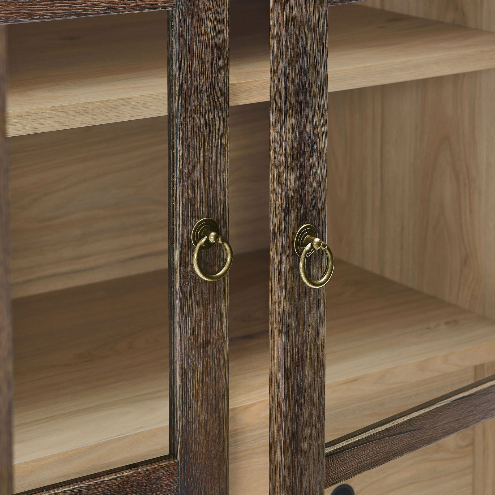 Brushed gold ring pulls accent the warm walnut hickory frame of the cabinet doors || EEI-6639-WAL-HCK || handle_studio
