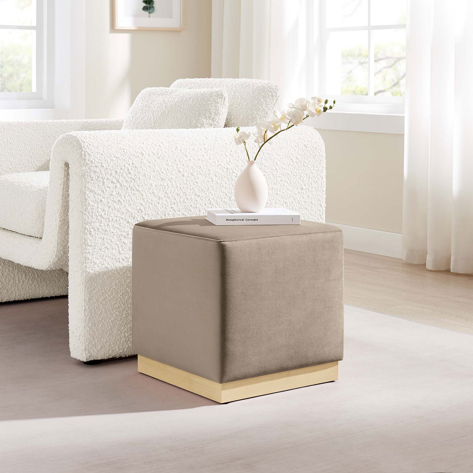 Modern taupe velvet ottoman lends soft texture and extra seating beside a cozy living room sofa. || EEI-6640-TAU-NAT || front_angle_room