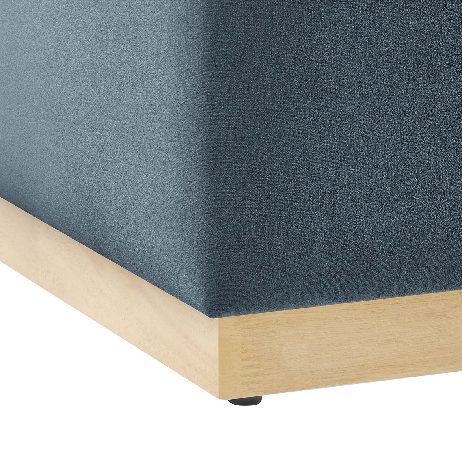 Natural wood plinth base with protective non marking glides beneath the ottoman corner || EEI-6643-CAB-NAT || leg_studio