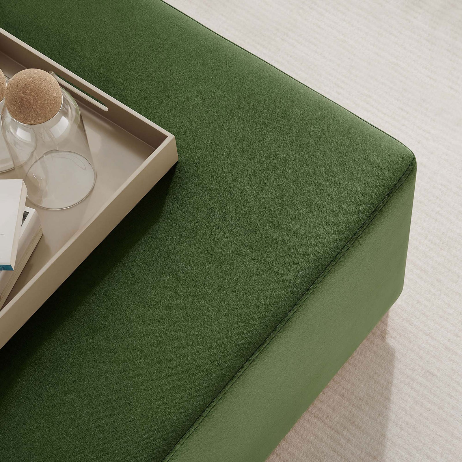 Moss green velvet ottoman styled with a tray and decor, adding a soft textured accent to a light modern living room || EEI-6643-MOG-NAT || detail_room
