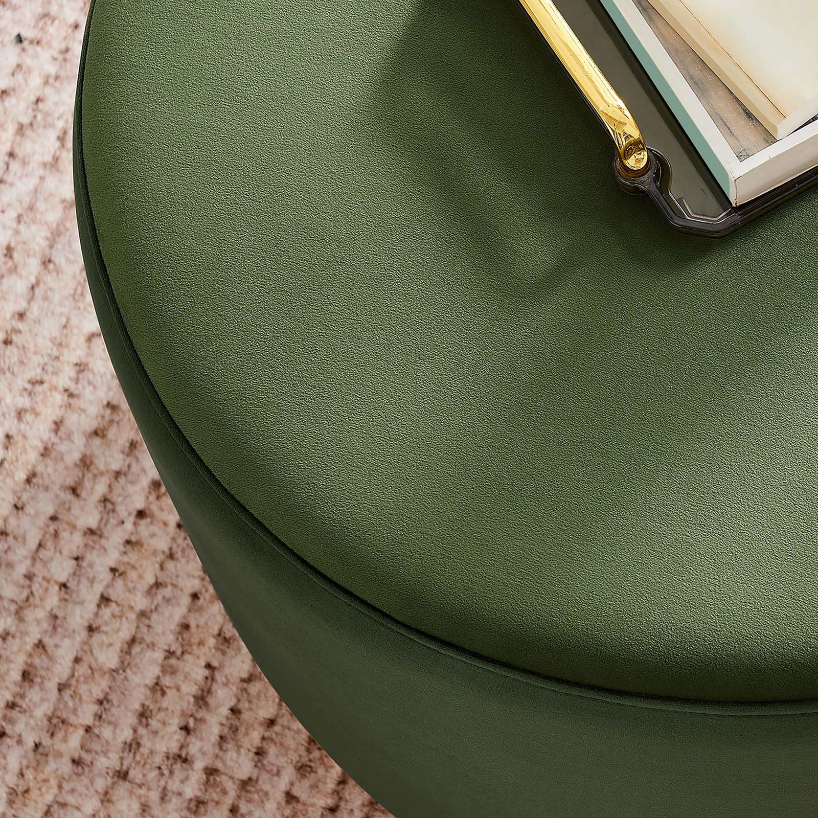 Moss green velvet ottoman styled as a chic coffee table atop a textured blush area rug. || EEI-6646-MOG-NAT || detail_room