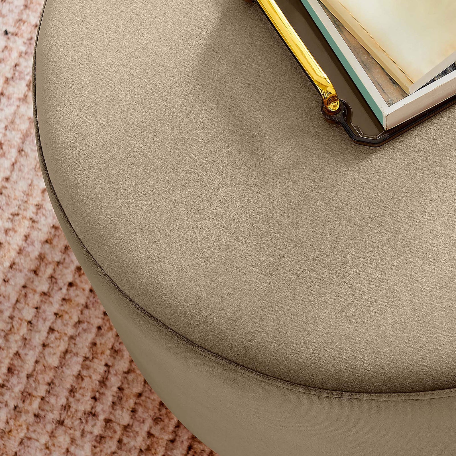 Taupe velvet ottoman styled as a coffee table with tray and books on a soft textured rug || EEI-6646-TAU-NAT || detail_room