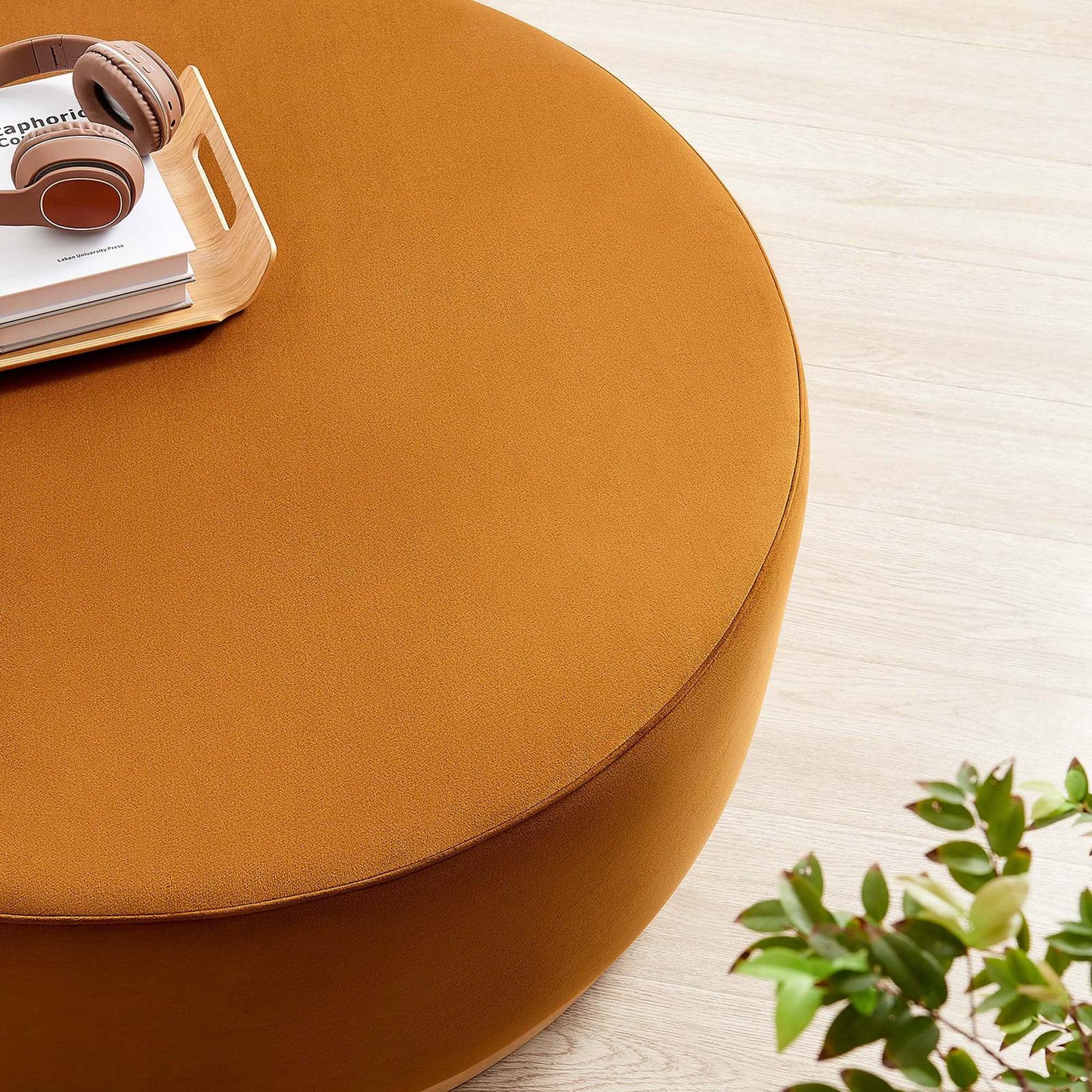 Large rust velvet ottoman with headphones and tray creating a cozy lounge coffee table. || EEI-6650-RUS-NAT || detail_room