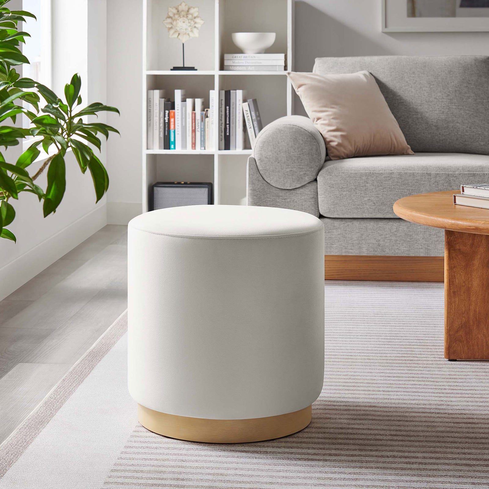 Versatile alabaster ottoman complements contemporary decor as a footrest or accent table in the lounge || EEI-6652-ALA-NAT || front_room