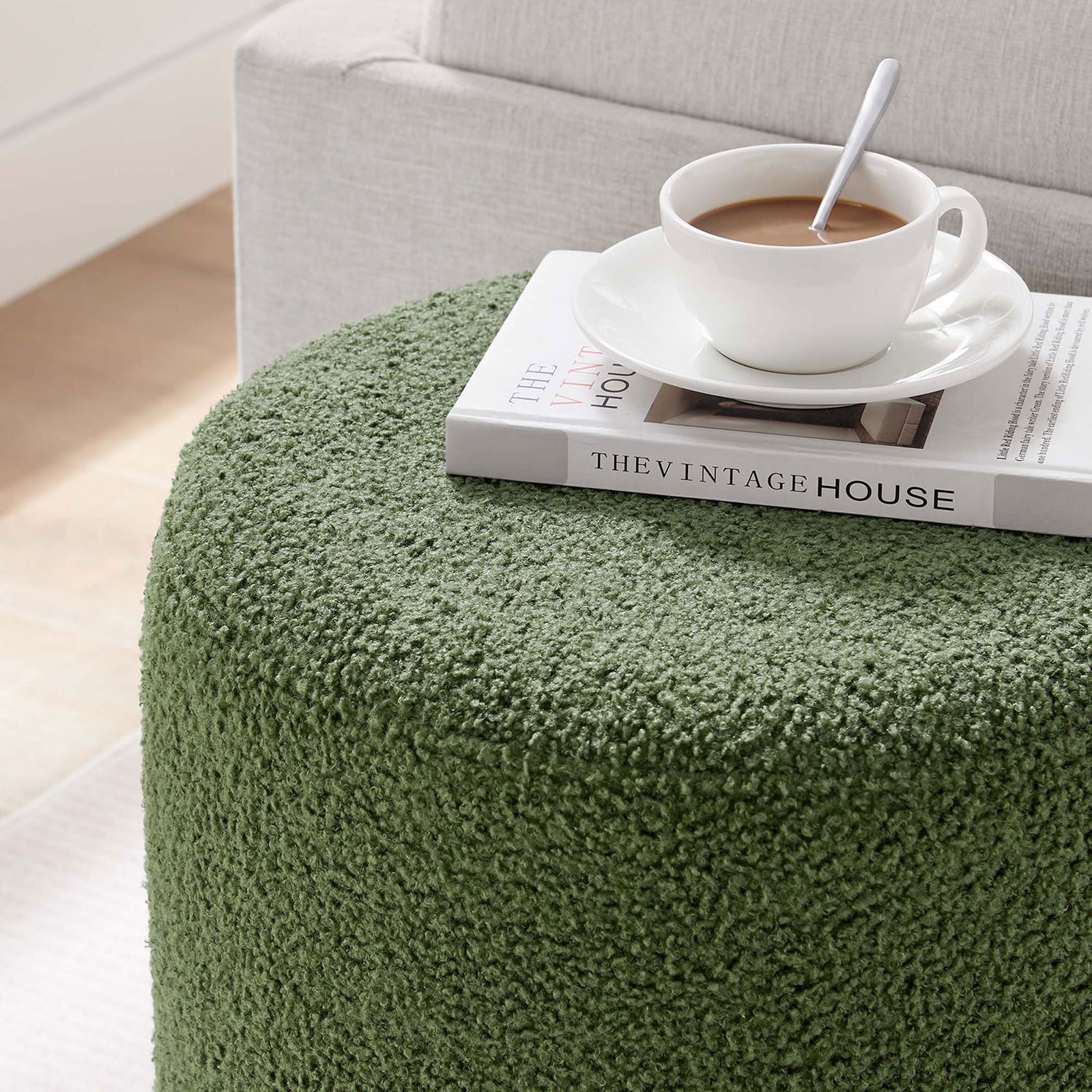 Sherpa ottoman used as a casual tabletop for coffee and books in a light, inviting living space || EEI-6653-MOG-NAT || detail_room