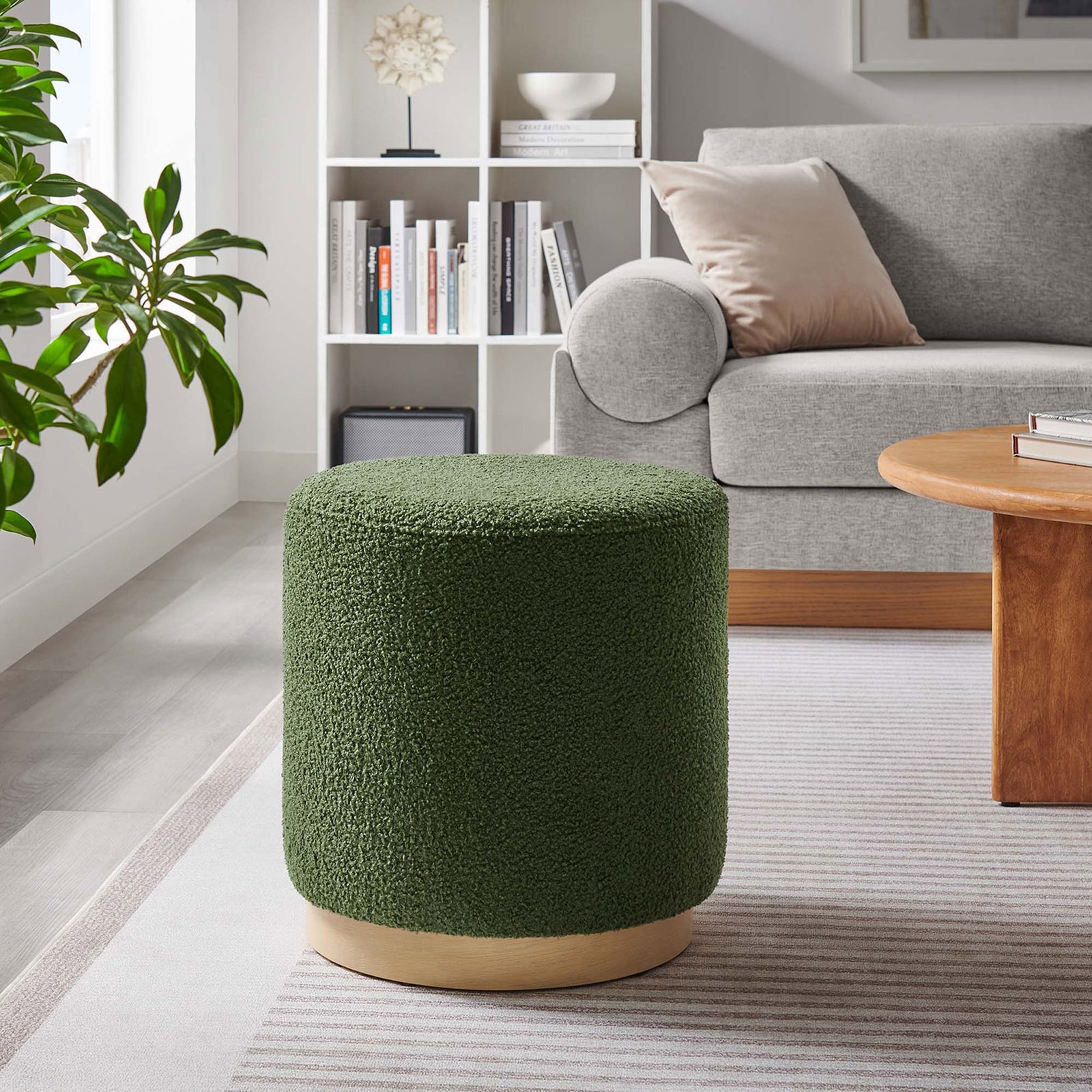 Round sherpa ottoman adds a pop of moss green color and soft texture to this contemporary living room || EEI-6653-MOG-NAT || front_room