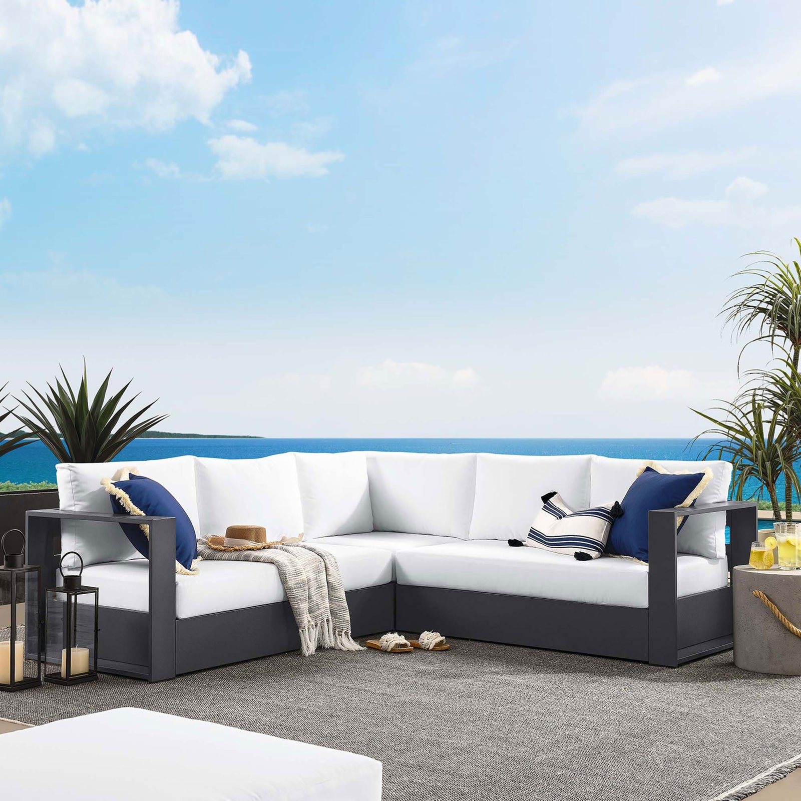 White Tahoe sectional arranged on a breezy patio creates a bright coastal-inspired outdoor lounge || EEI-6668-GRY-WHI || front_room