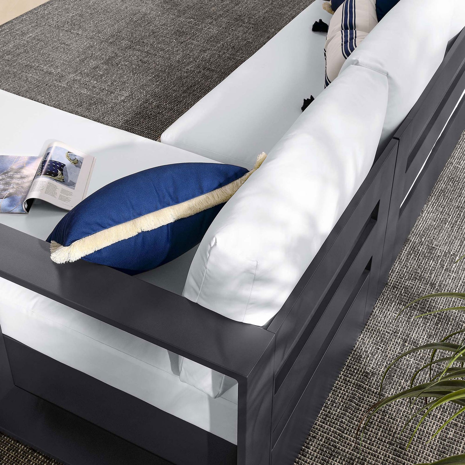 White seat cushions and blue accent pillows lend a crisp, coastal feel to the Tahoe sectional || EEI-6669-GRY-WHI || detail_room
