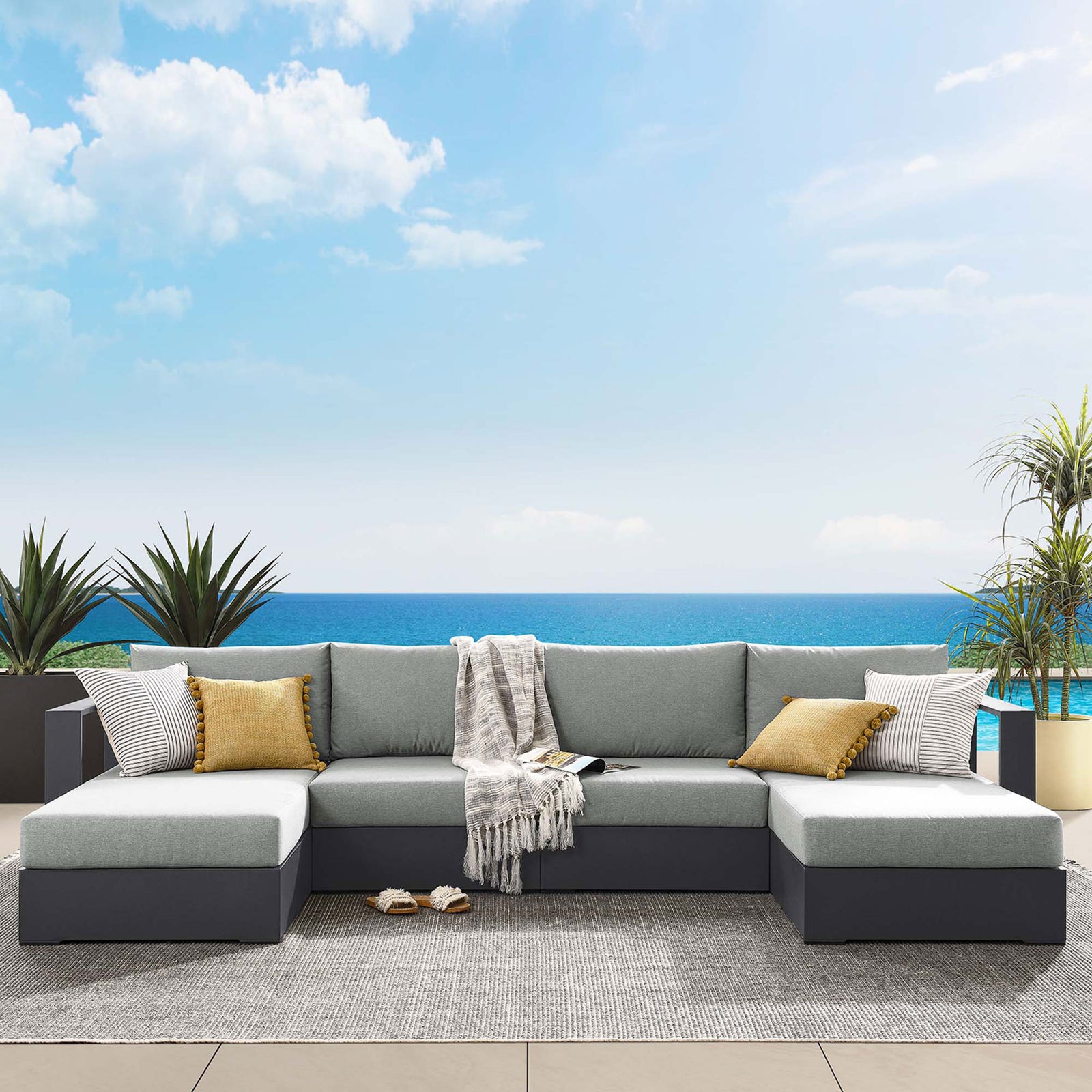 Tahoe outdoor sectional with gray cushions styled for coastal lounging on a spacious poolside terrace || EEI-6676-GRY-GRY || front_angle_room