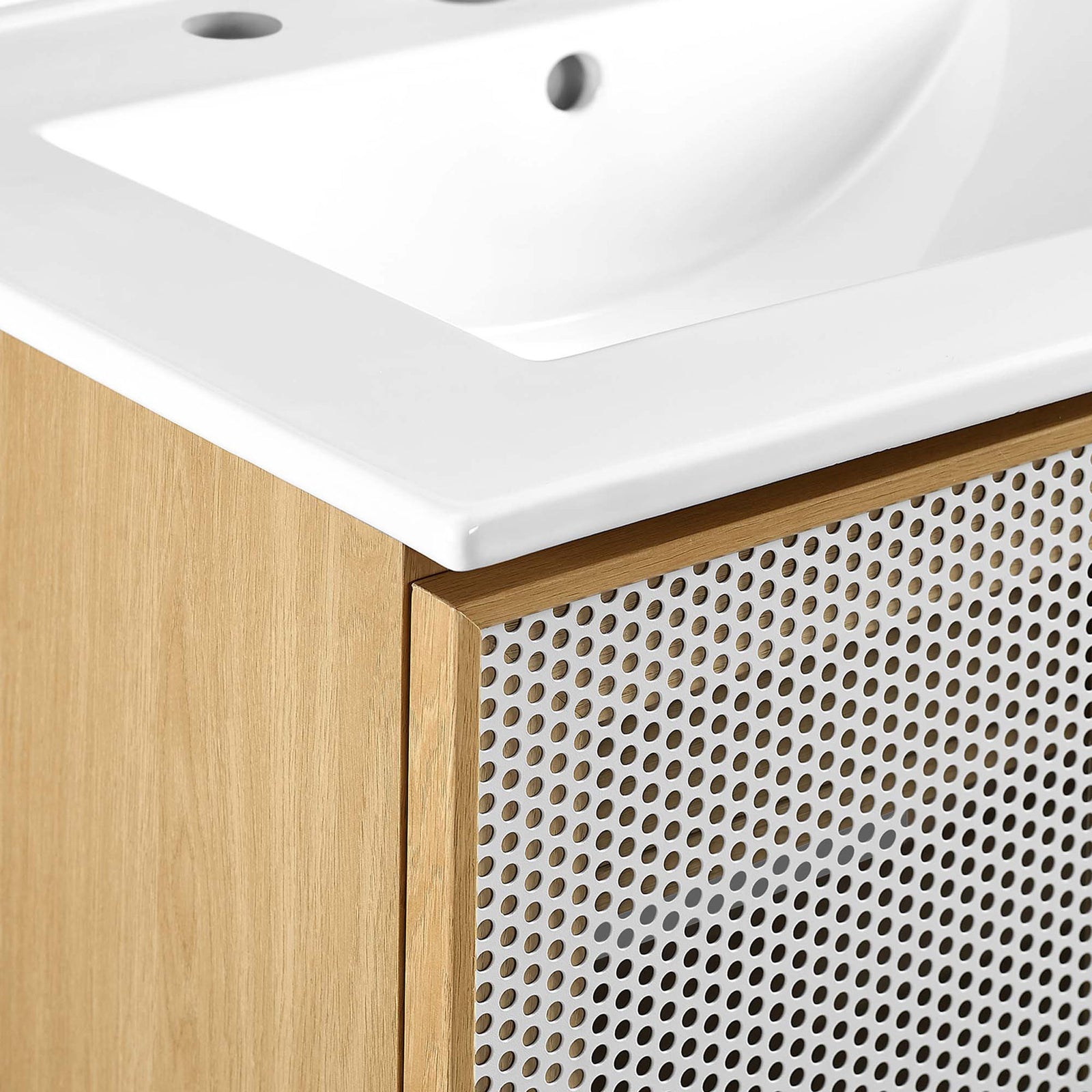 Crisp white ceramic top meets warm oak grain and perforated metal for bold texture contrast. || EEI-6677-WHI-OAK || detail_studio