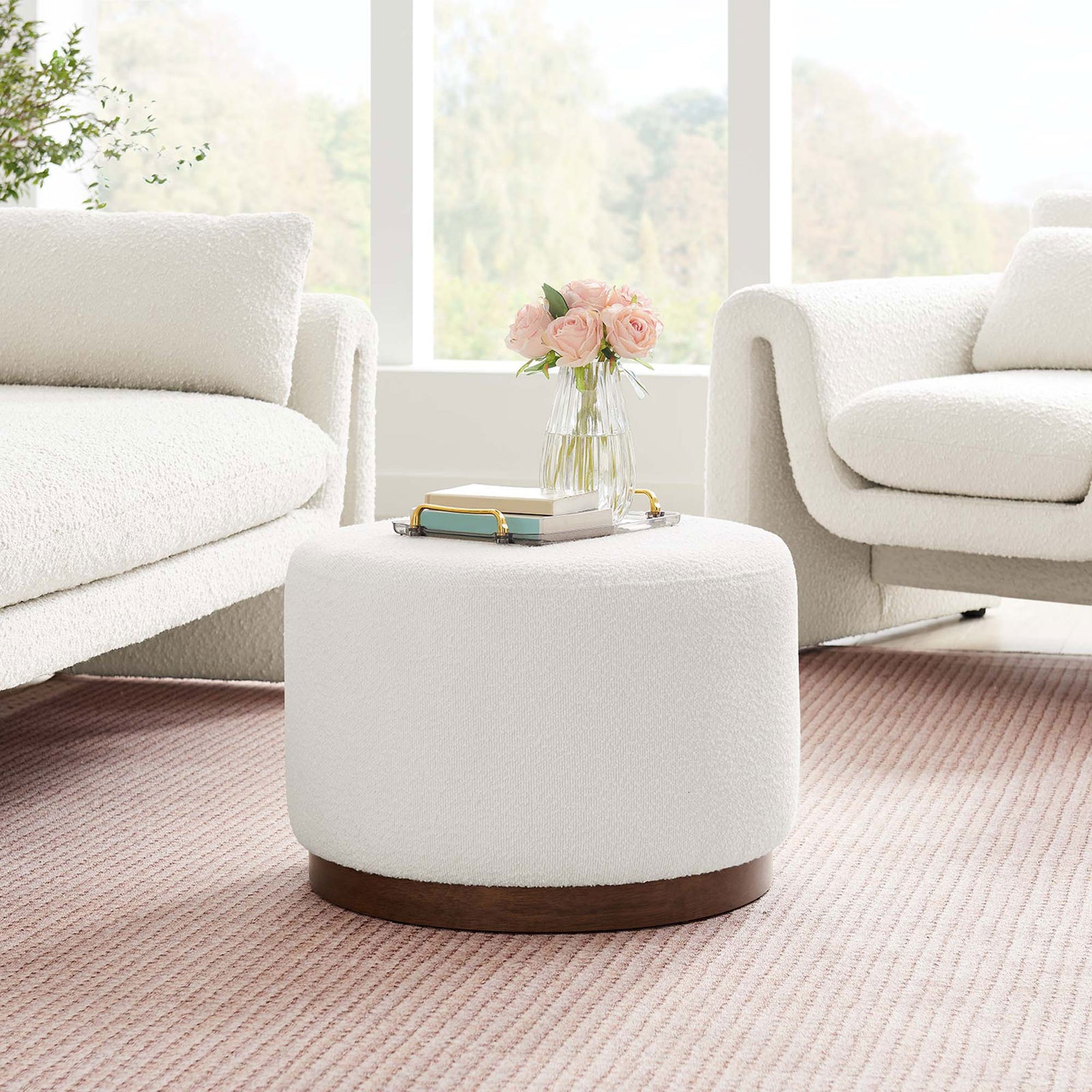 Cloud boucle round ottoman with walnut base styled as a coffee table between plush white seating || EEI-6683-CLO-WAL || front_room