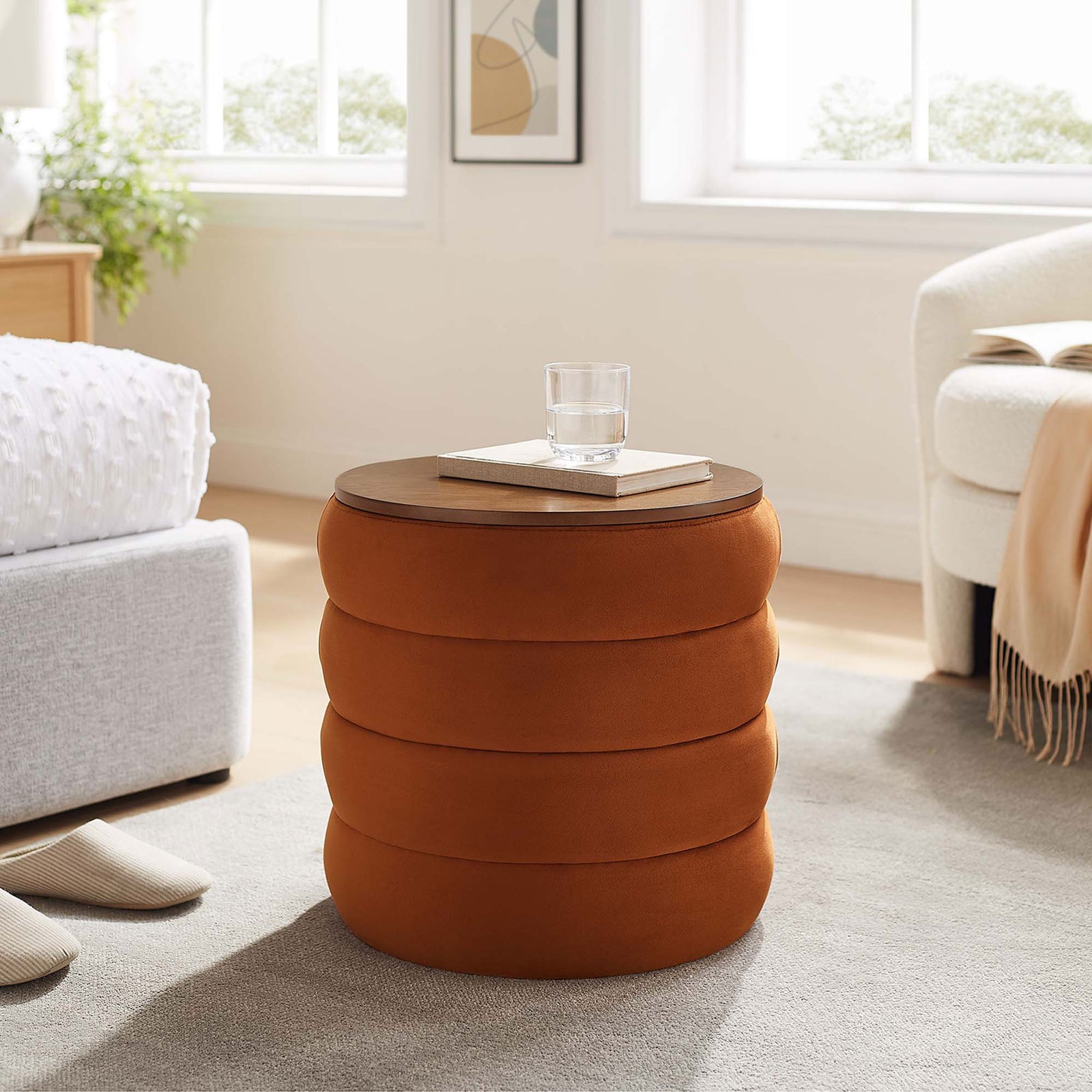 Rust velvet storage ottoman styled in a bright bedroom, serving as a handy bedside table || EEI-6684-RUS || front_angle_room
