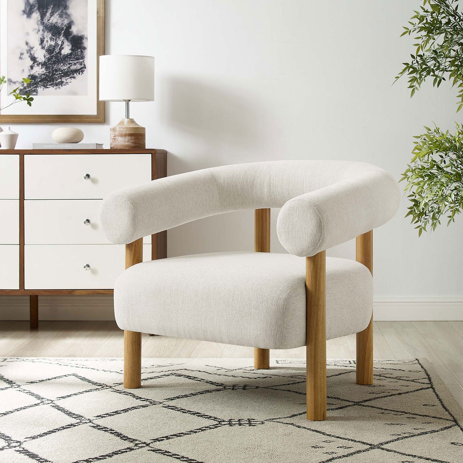 Inviting ivory lounge chair anchors the room with a cozy oversized cushion and rounded open back || EEI-6689-IVO-NAT || front_angle_room
